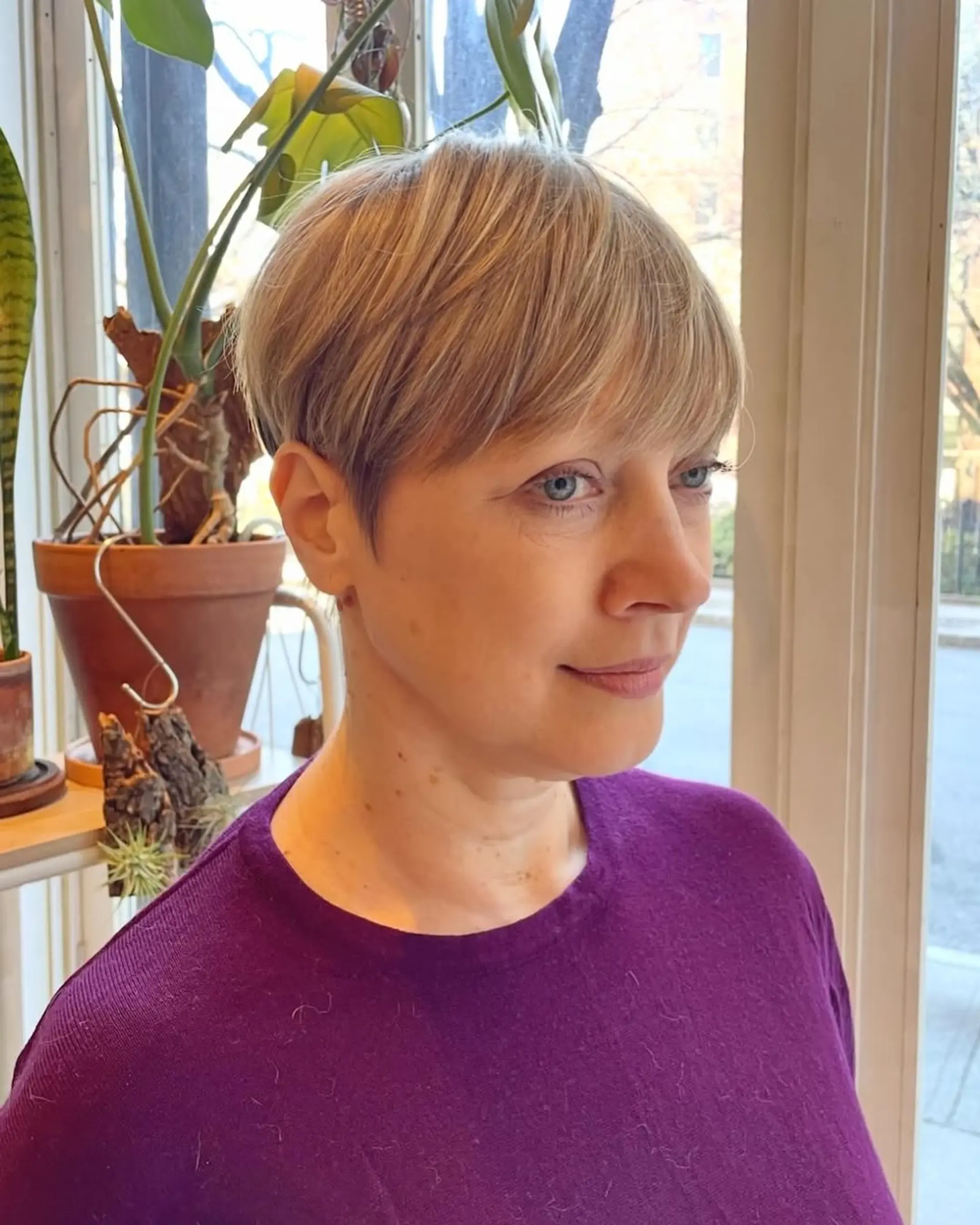 A short pixie cut with textured bangs. 1