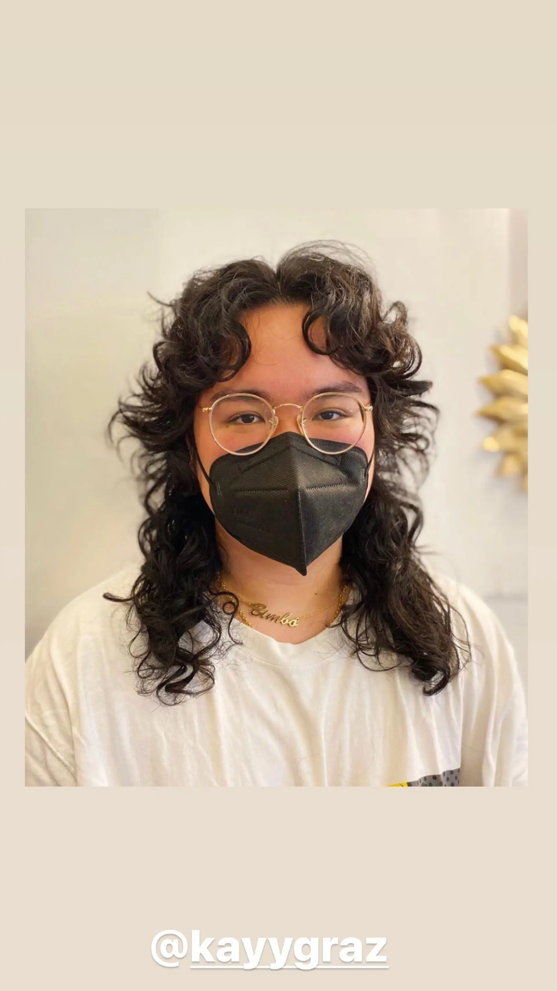 A layered shag haircut with a curly texture and fringe. 1