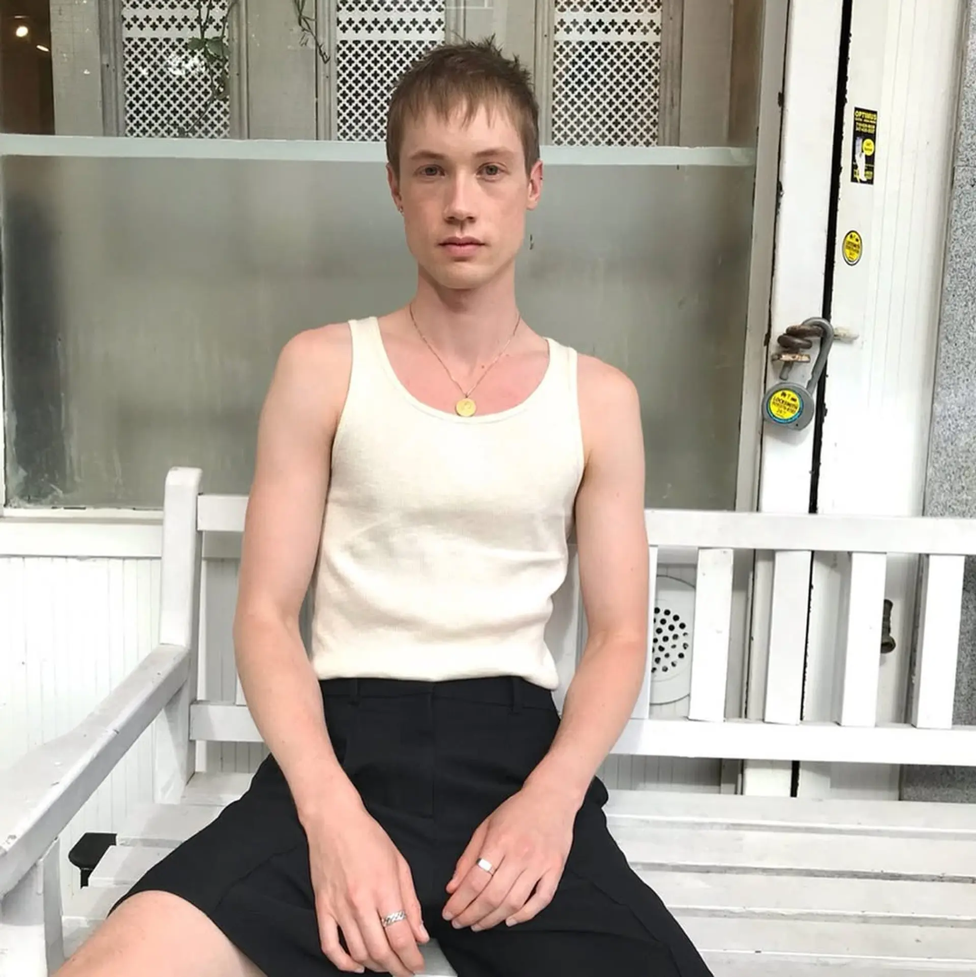 Short, light brown hair styled in a tousled and textured manner with an asymmetric fringe and tapered sides. 2