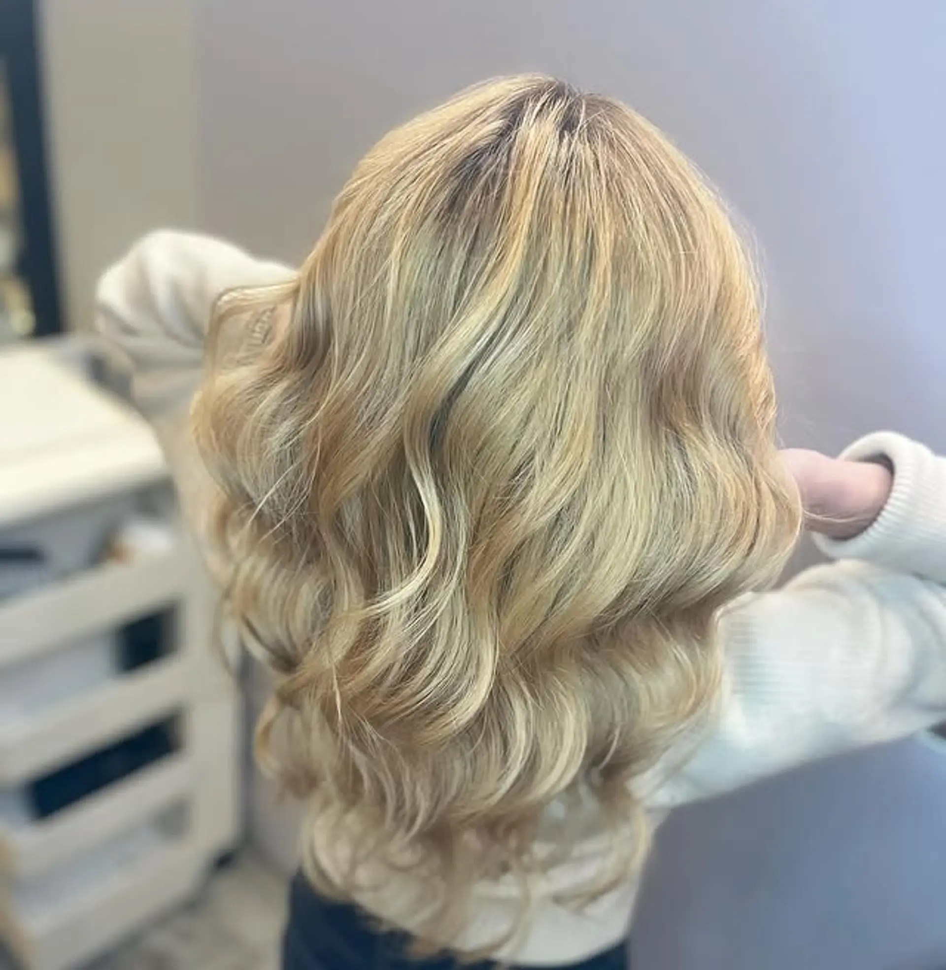 Long, soft, beachy waves with a dimensional blonde balayage. 1