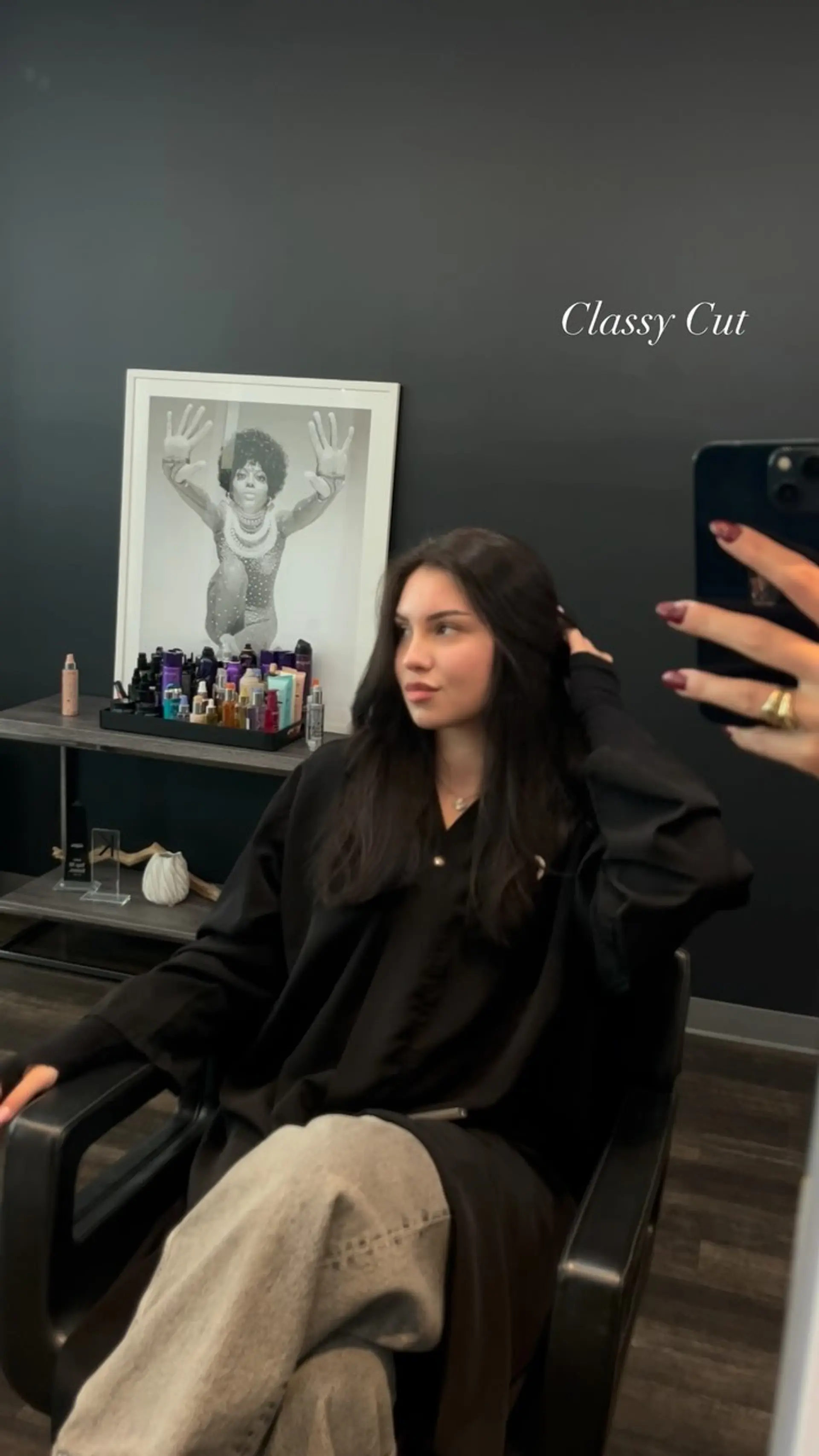Long dark brunette hair styled with subtle framing layers and a smooth, polished blowout parted down the center. 1