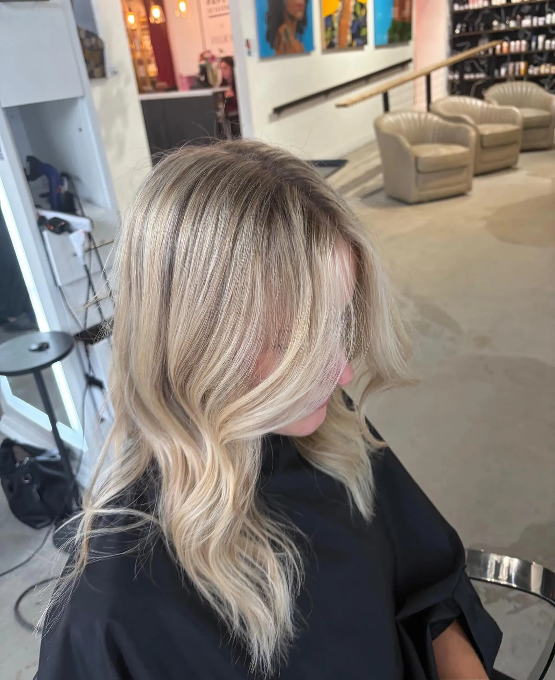 Medium-length dimensional blonde hair with soft, loose waves and face-framing layers. 1