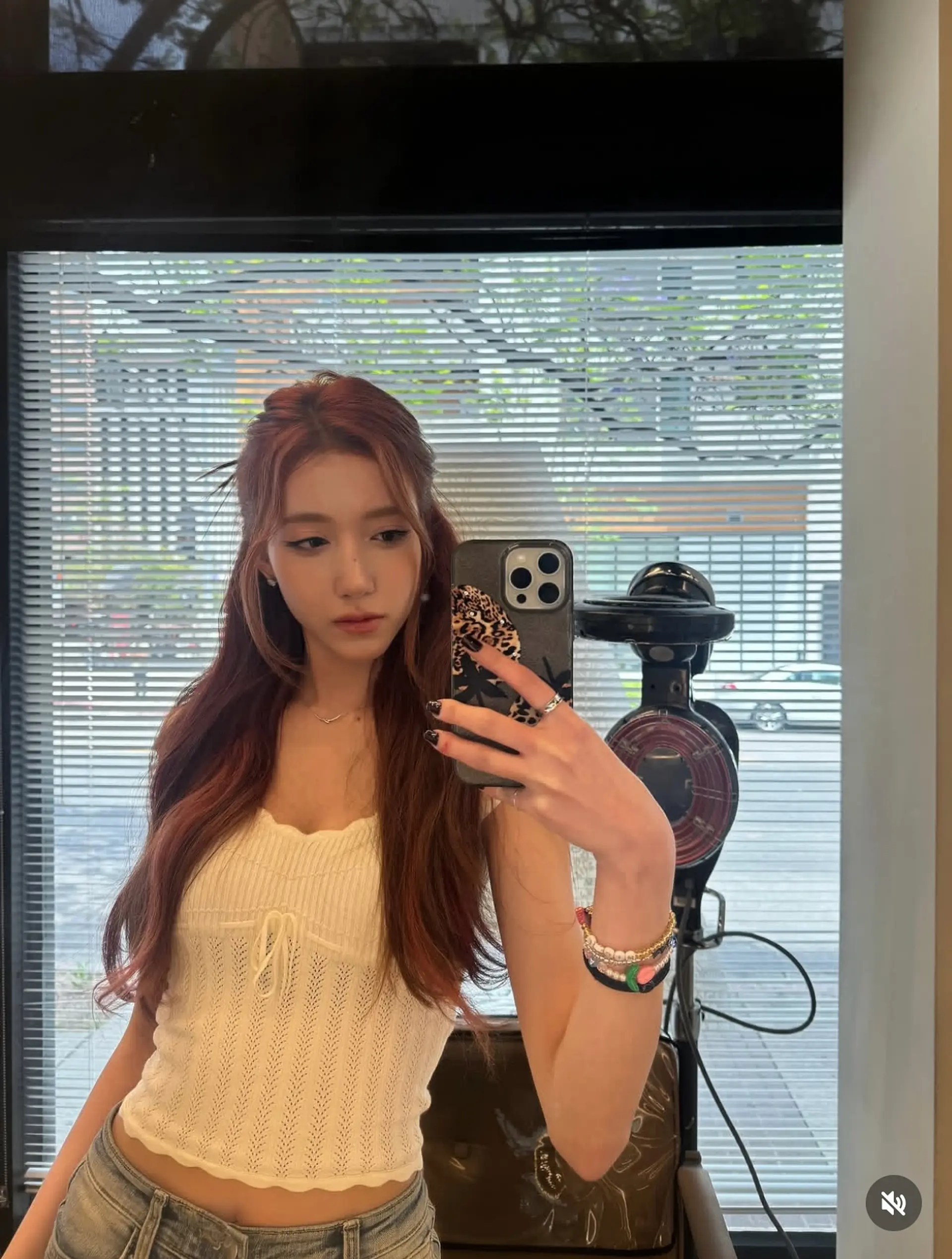 Long, wavy auburn hair with soft, face-framing layers. 1