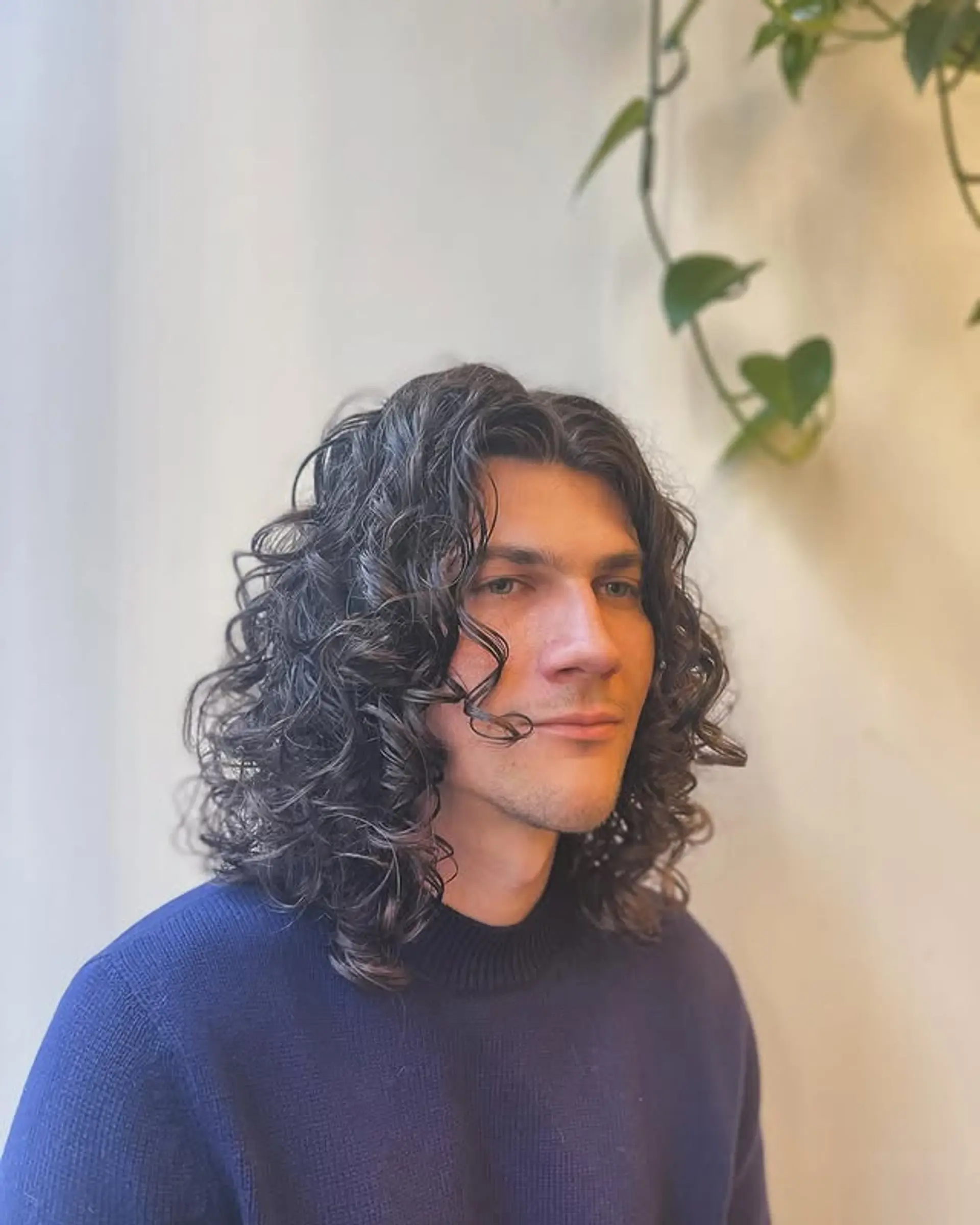 Medium-length curly hairstyle with defined curls. 1