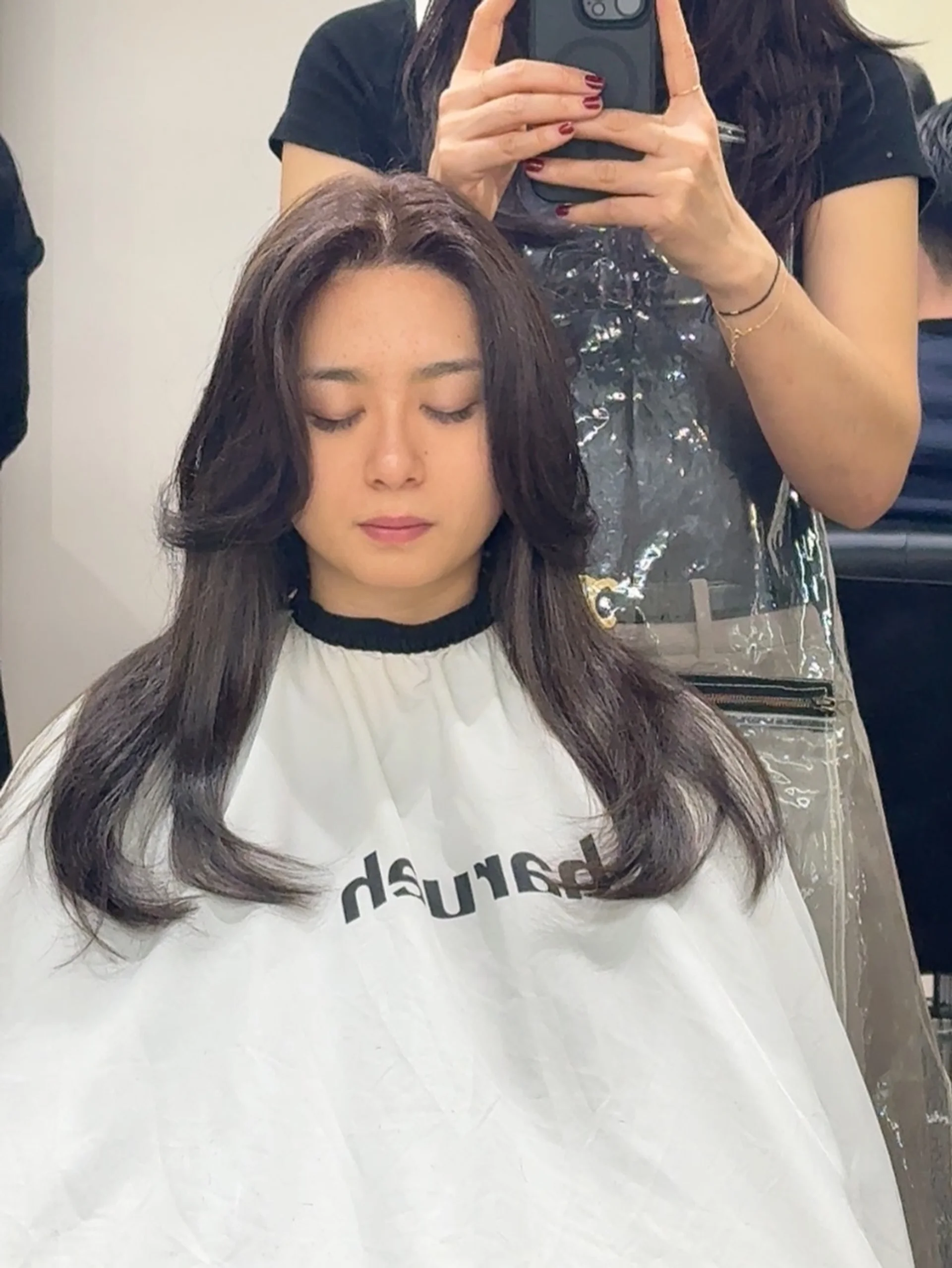 Modern brunette butterfly haircut showcasing cascading layers and expressive volume - Preview 1