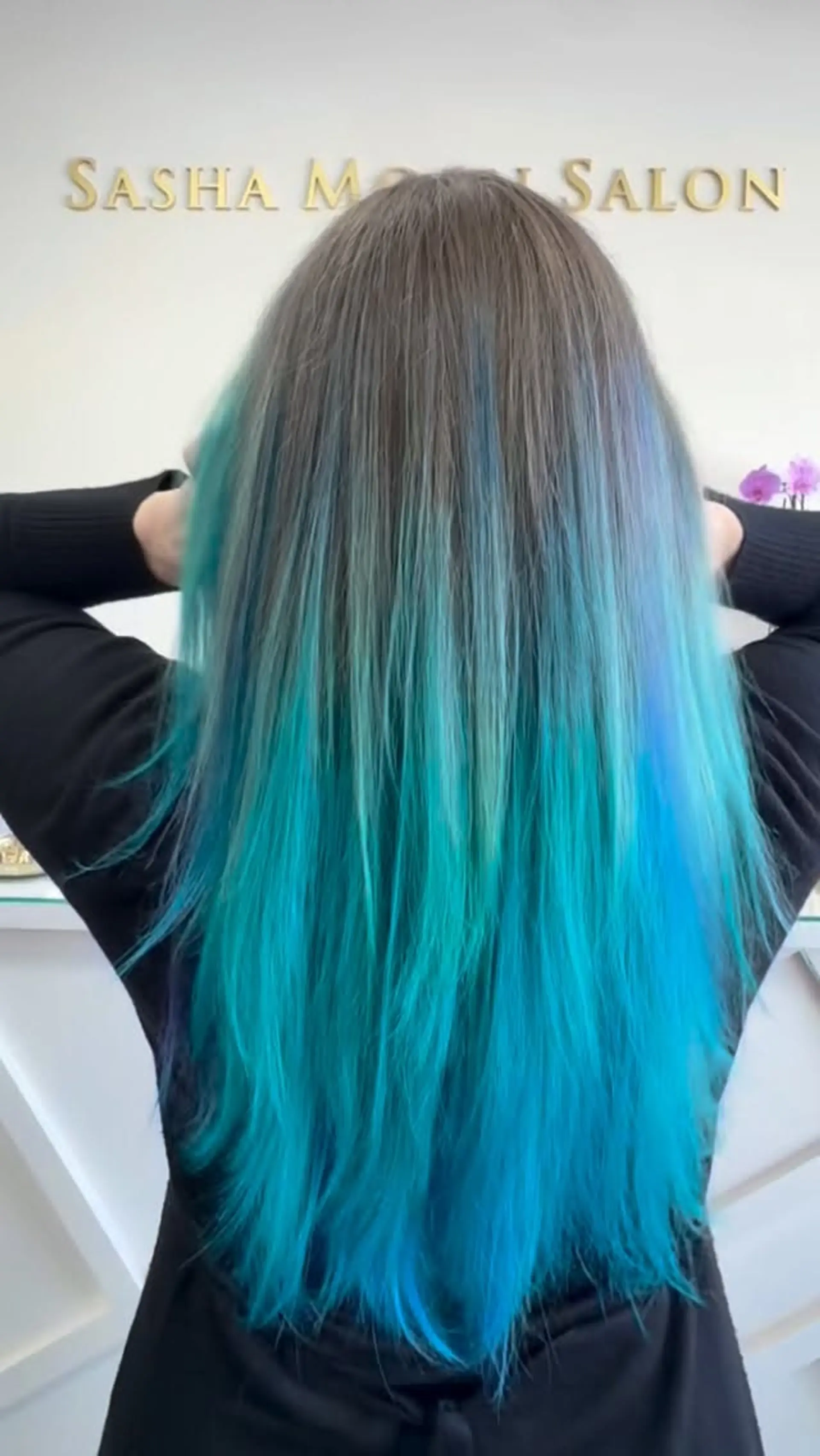 Straight, long hair featuring a natural ash brown root melting into vibrant shades of aquamarine and ocean blue. 1