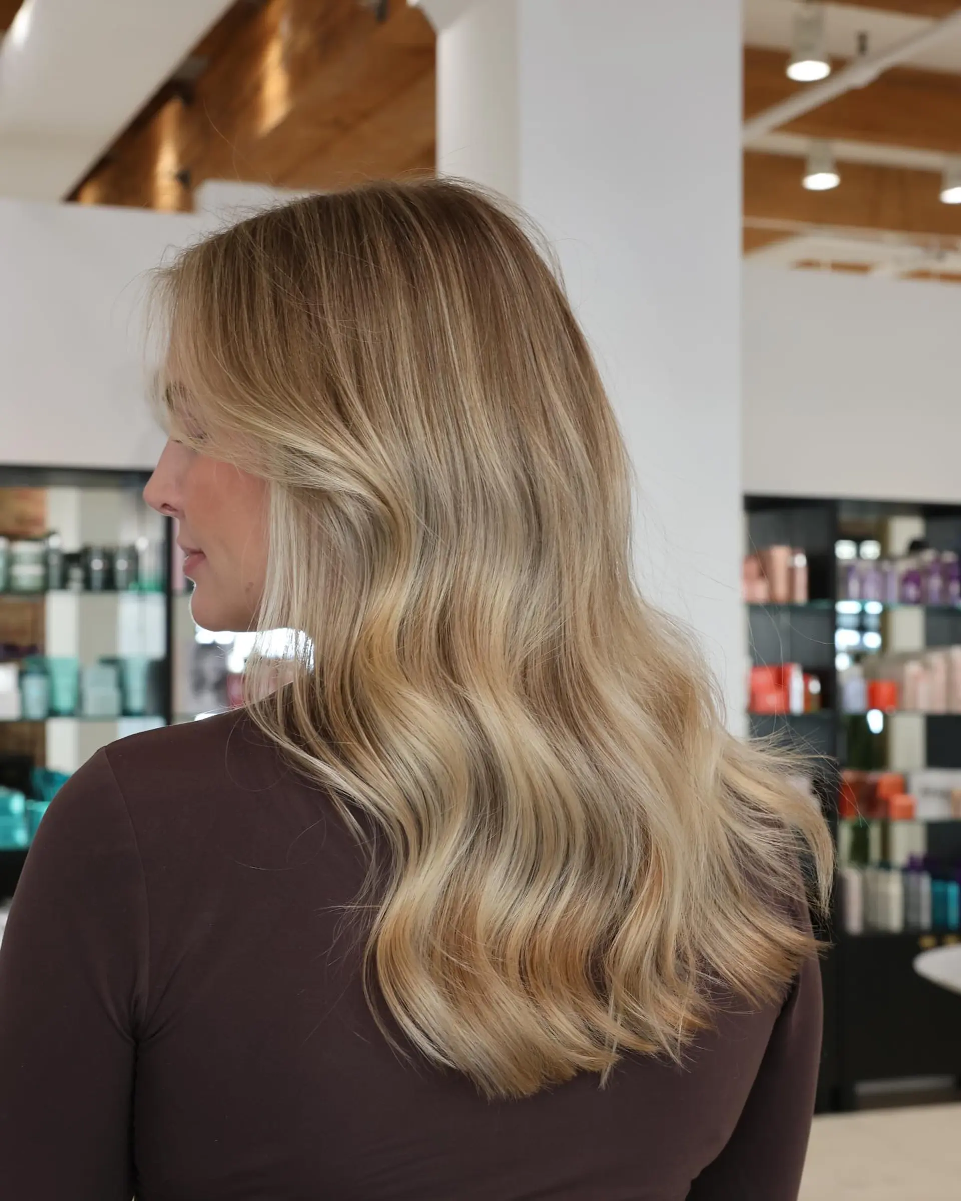 Medium length wavy hair with blonde balayage. 7