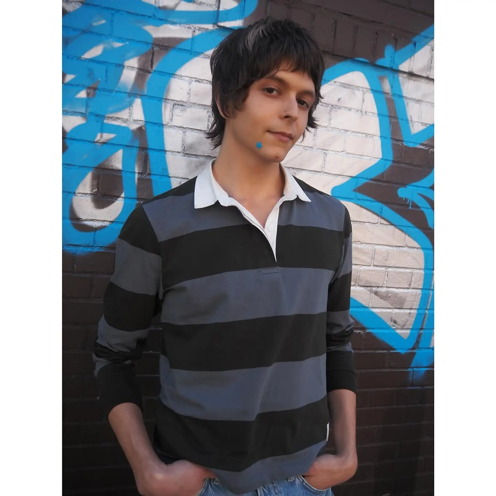 Emo-inspired medium length hairstyle with choppy layers and highlights in the fringe. 1