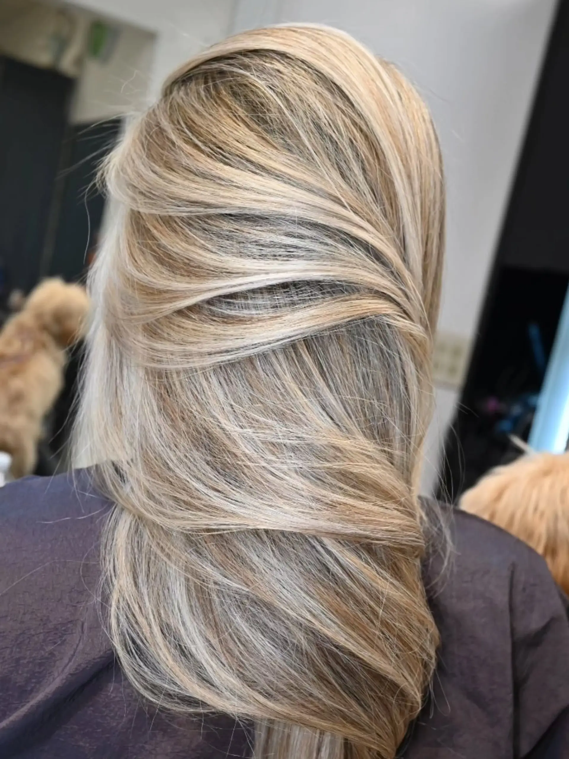 Long hair styled with fine, cool-toned ash blonde highlights blended over a natural base. 1