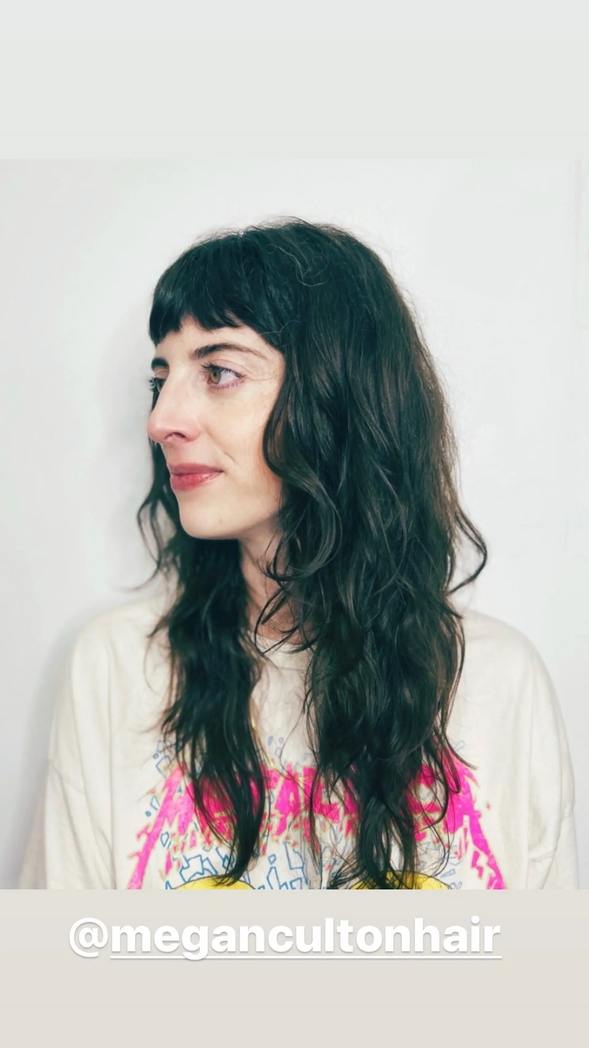 A long, wavy shag with baby bangs and choppy layers. 1