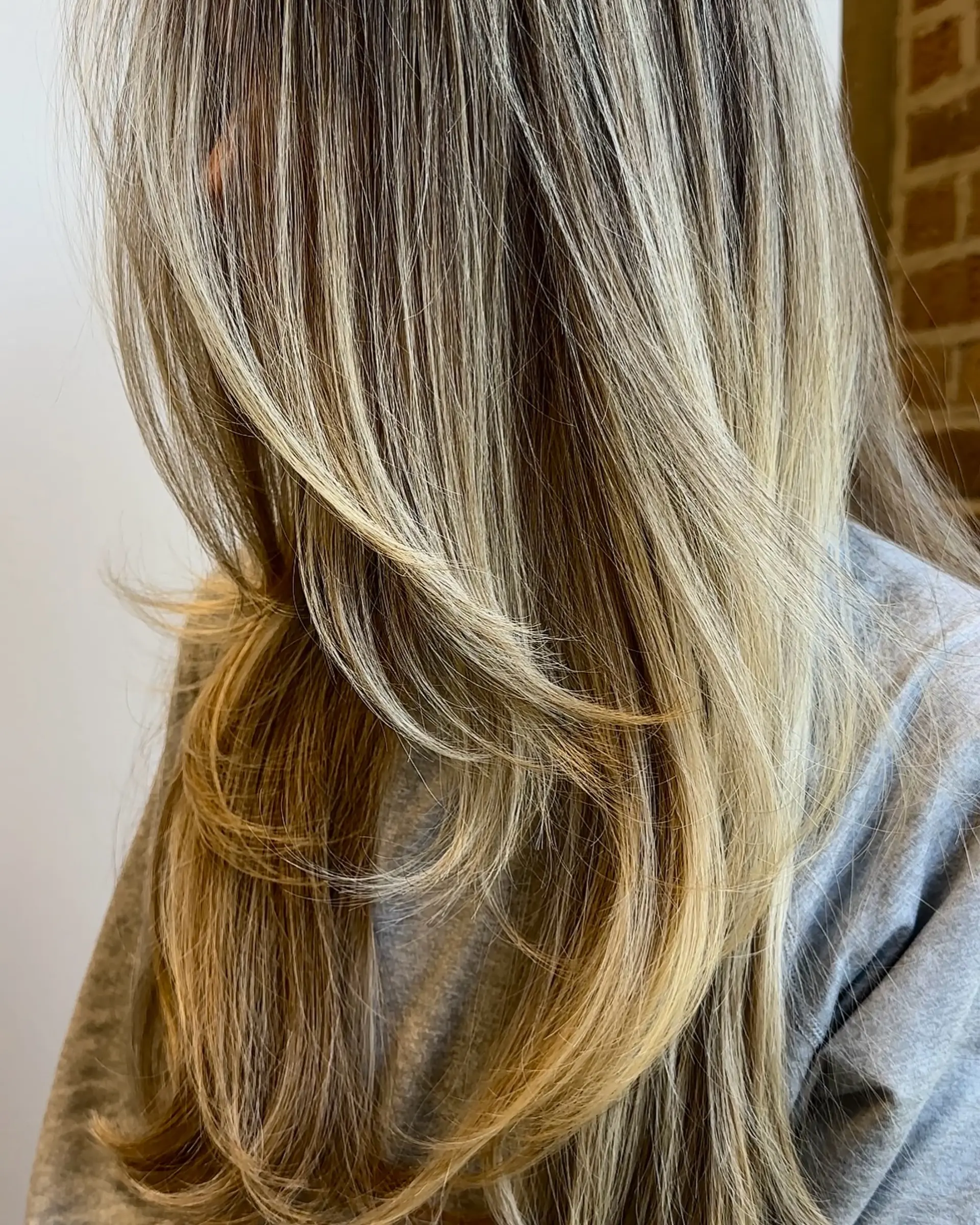 A long layered haircut with face-framing layers for added dimension and movement. 1