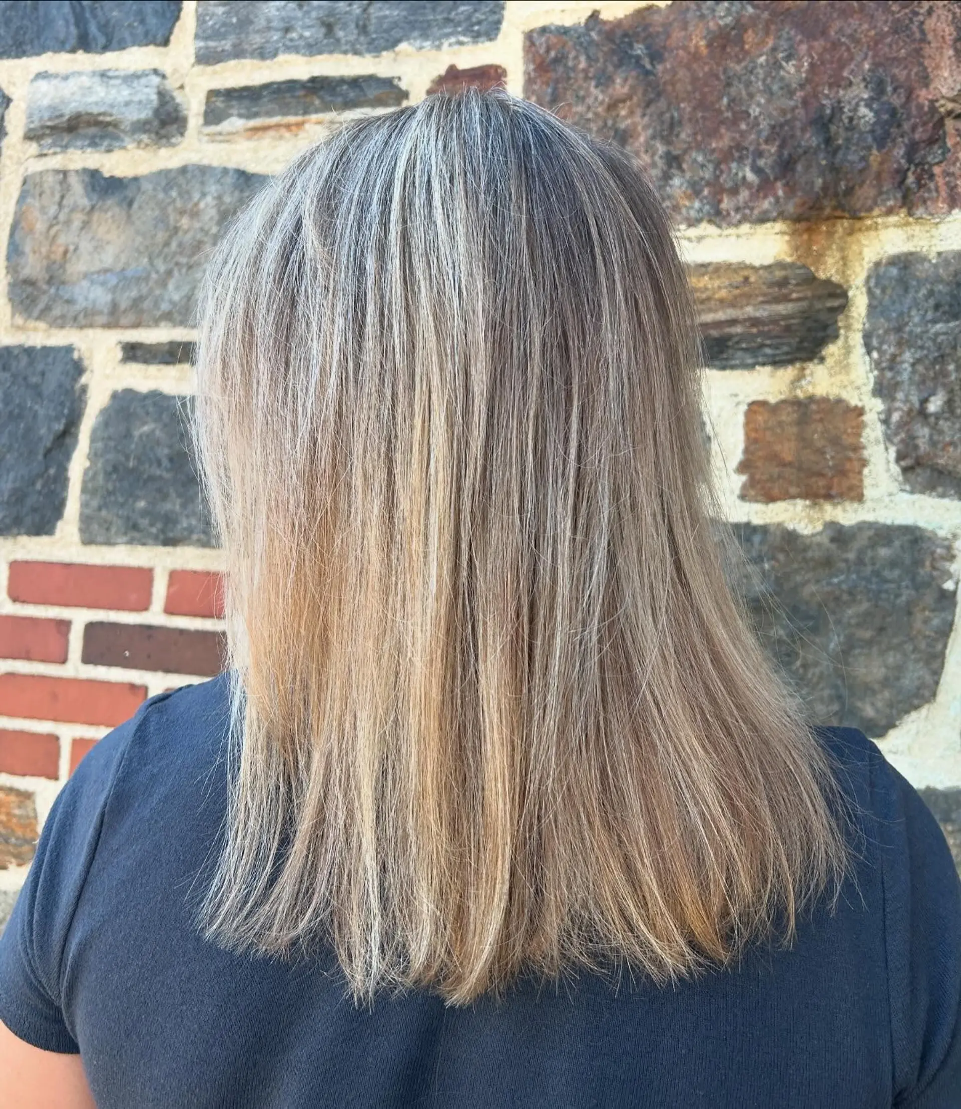 Medium-length straight hair featuring fine blonde and silver highlights blended with natural grey and light brown tones. 1
