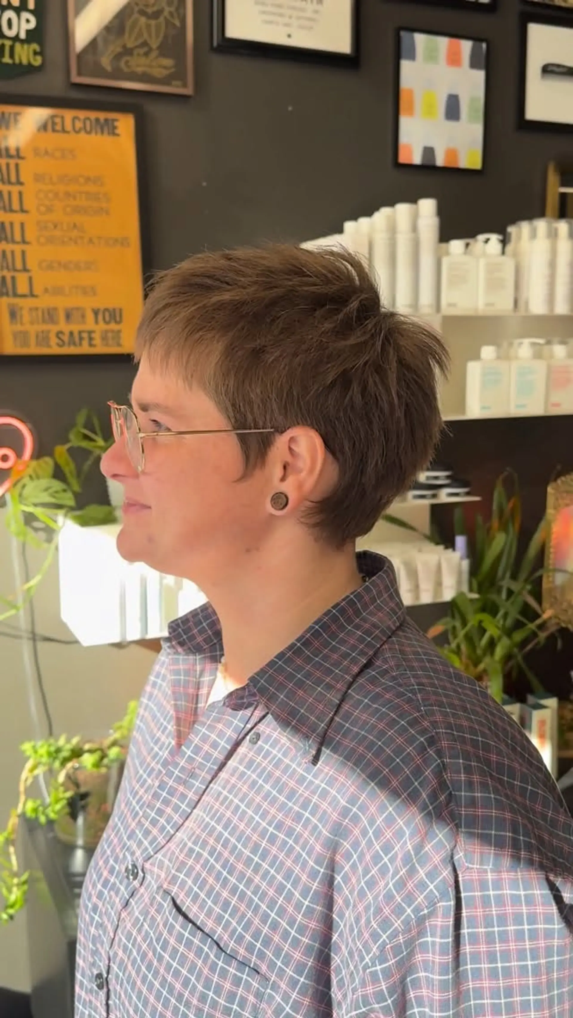 A short, piecey pixie cut featuring soft razor texture and micro fringe. 1
