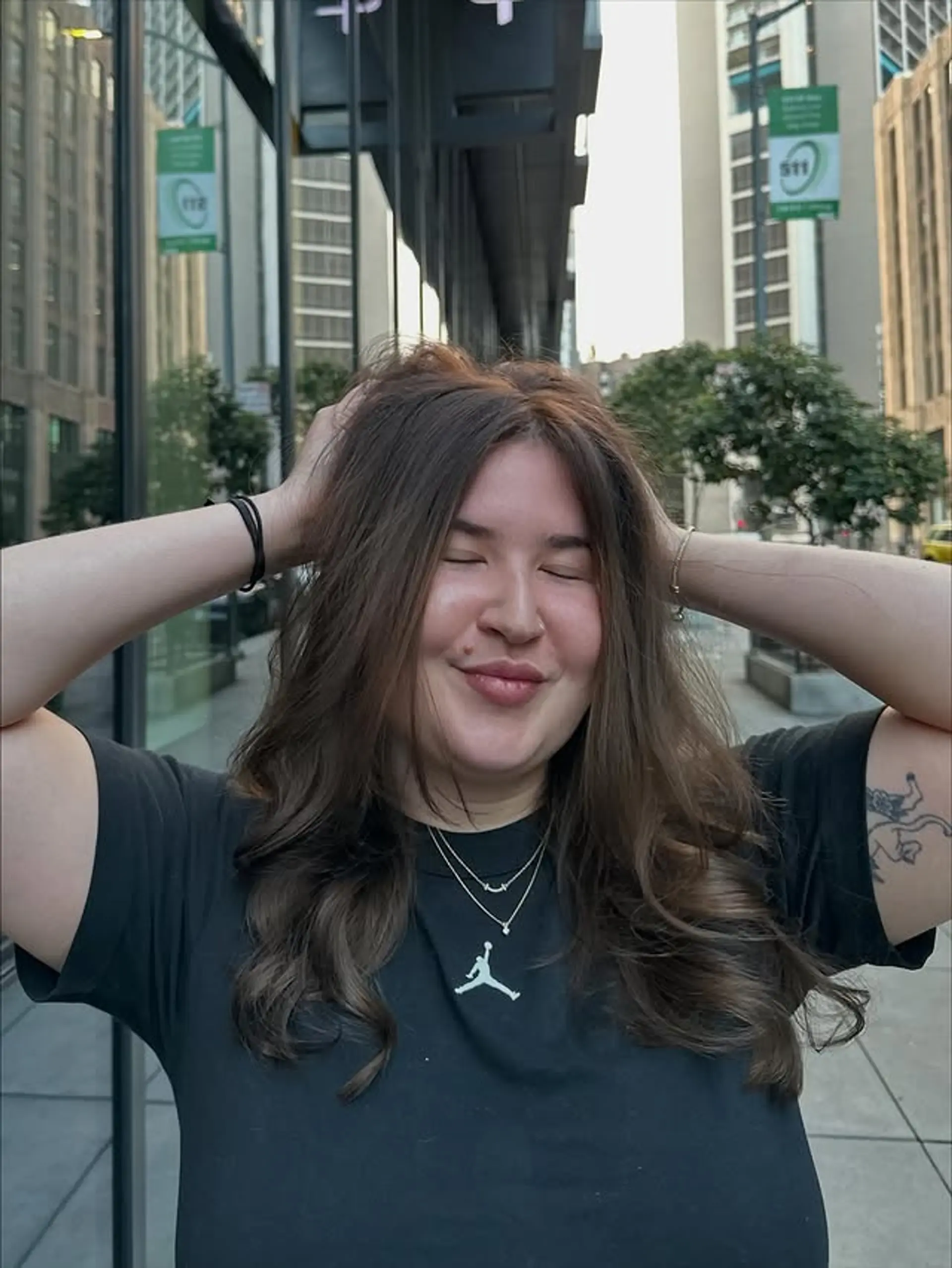 Long, wavy brunette hair with face-framing layers for added volume and movement. 1