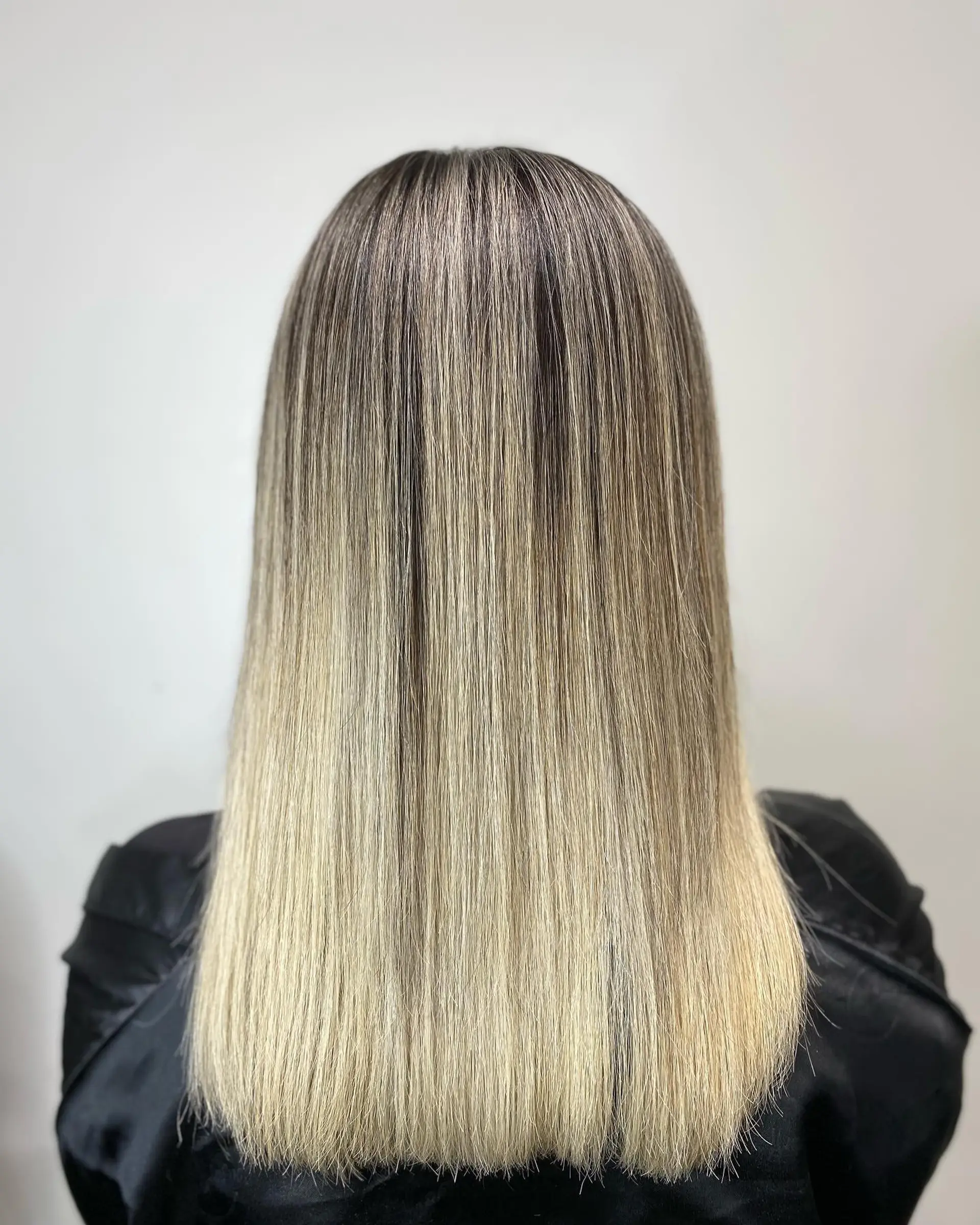 Long, straight hair with a seamless ombre color transition. 3