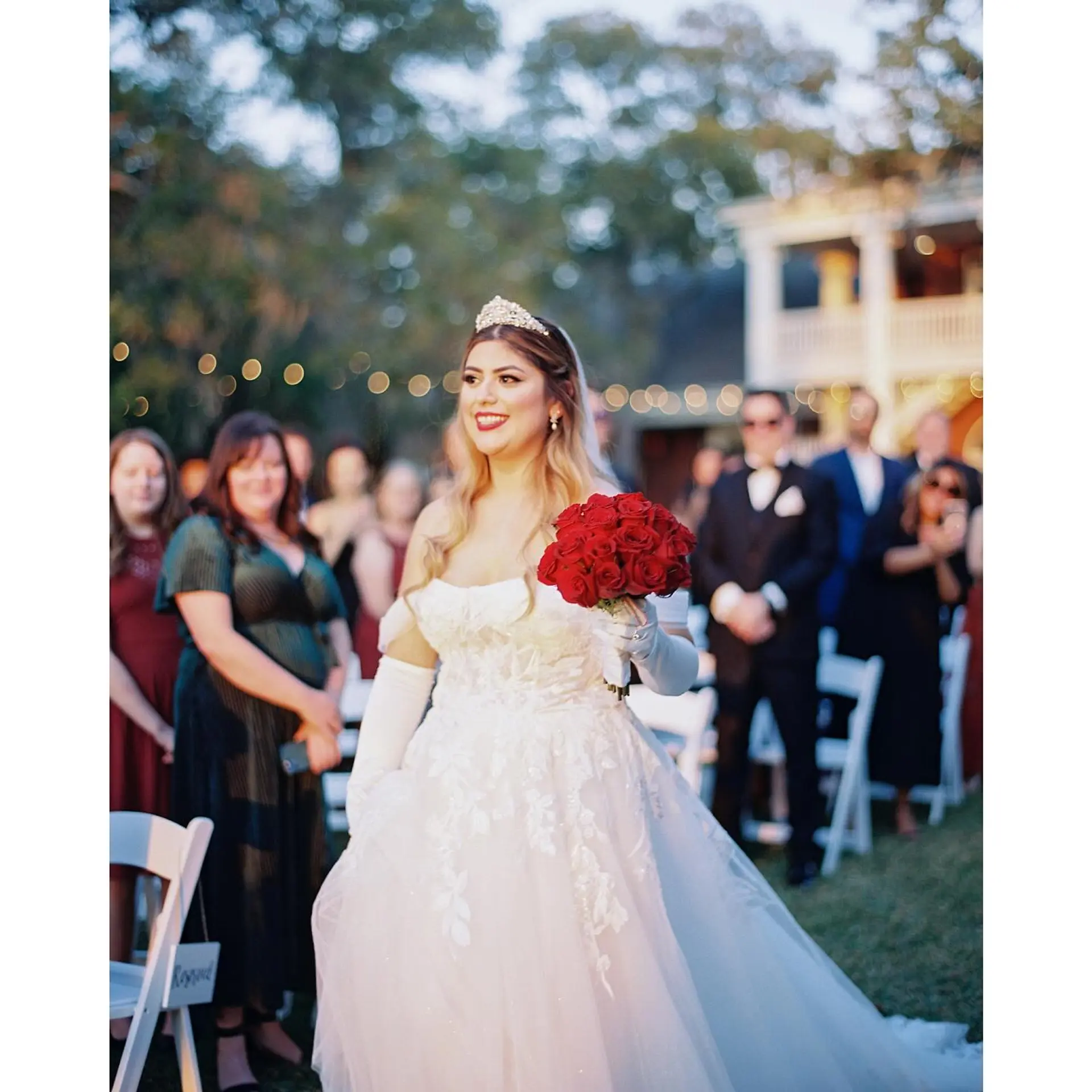 Long, romantic bridal glamour waves worn down and accented with a sparkling tiara and veil. 1