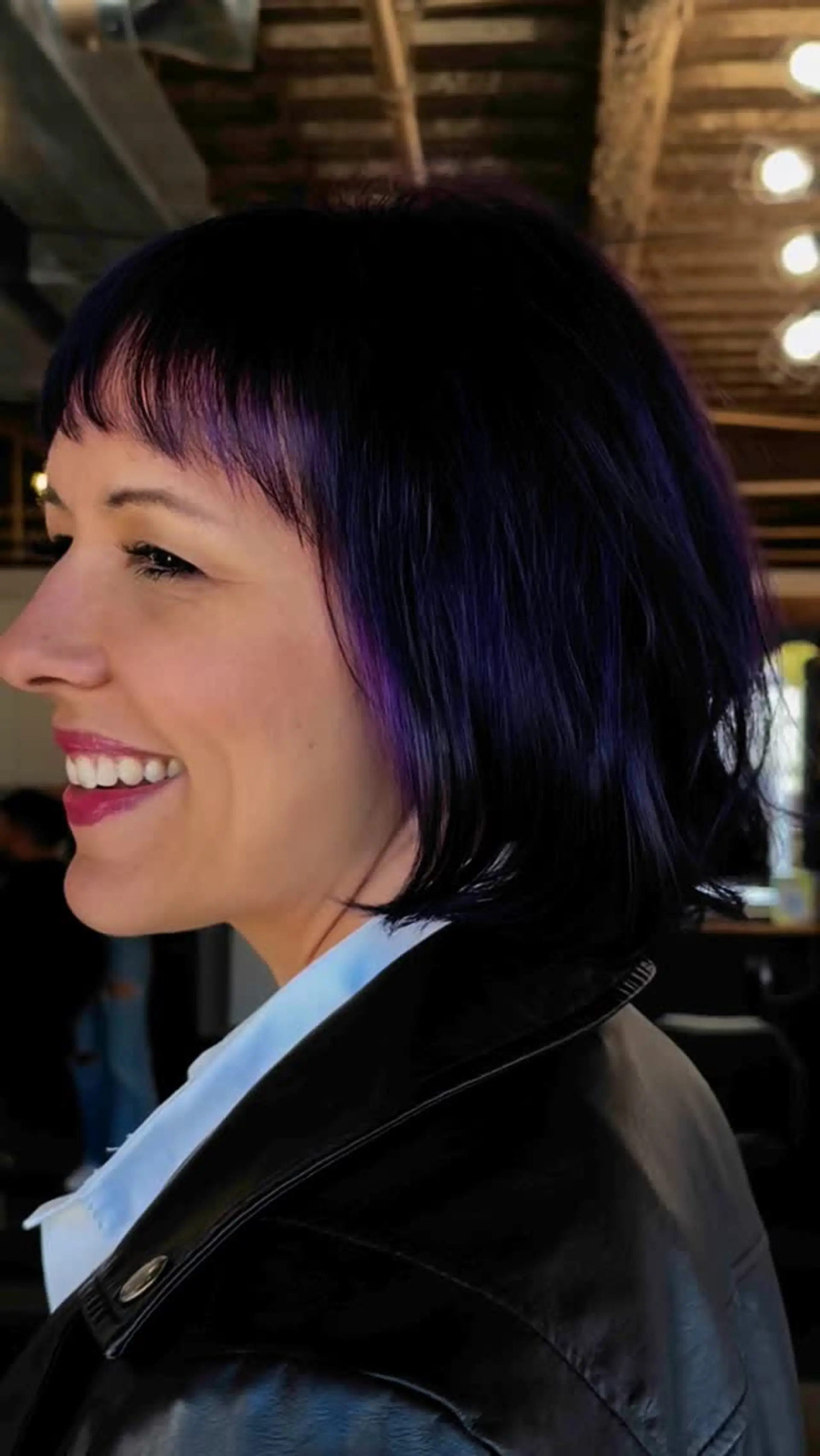 A chin-length textured French bob with wispy fringe bangs, colored in deep vivid violet-purple tones over a dark base. 1
