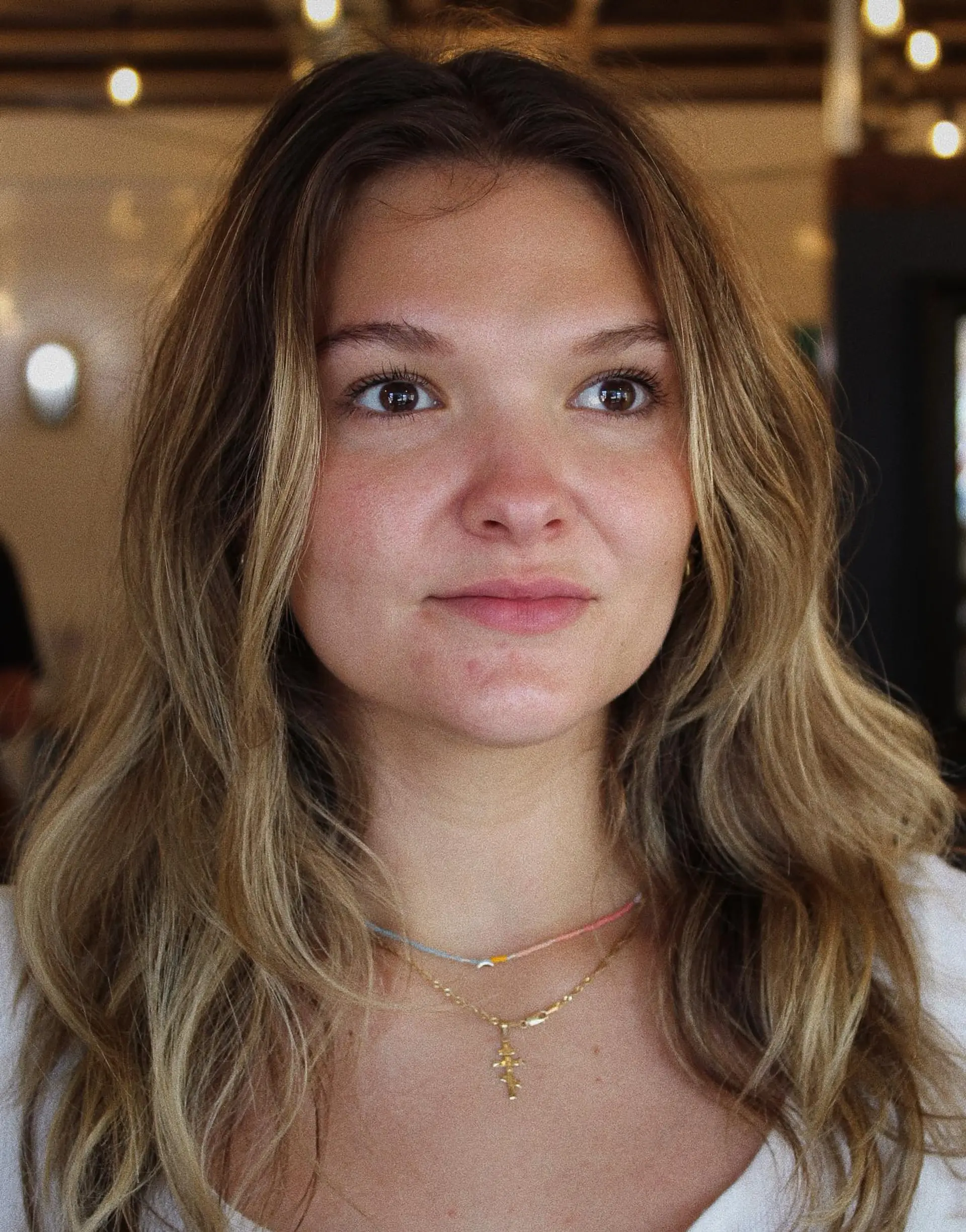 Long wavy hair featuring a dimensional balayage with blended highlights and lowlights. 1