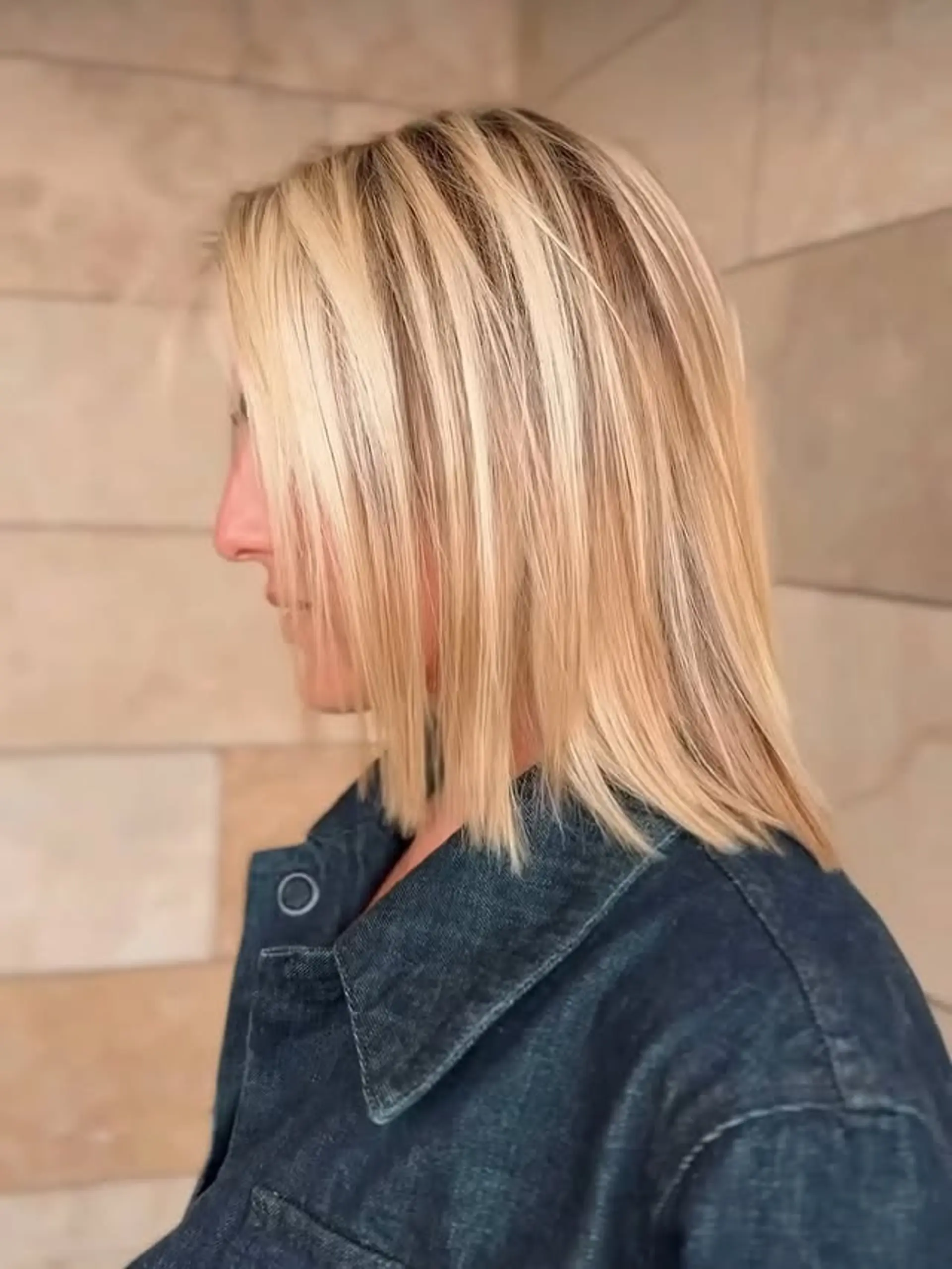 A chic, straight blunt bob with cool-toned blonde highlights. 1