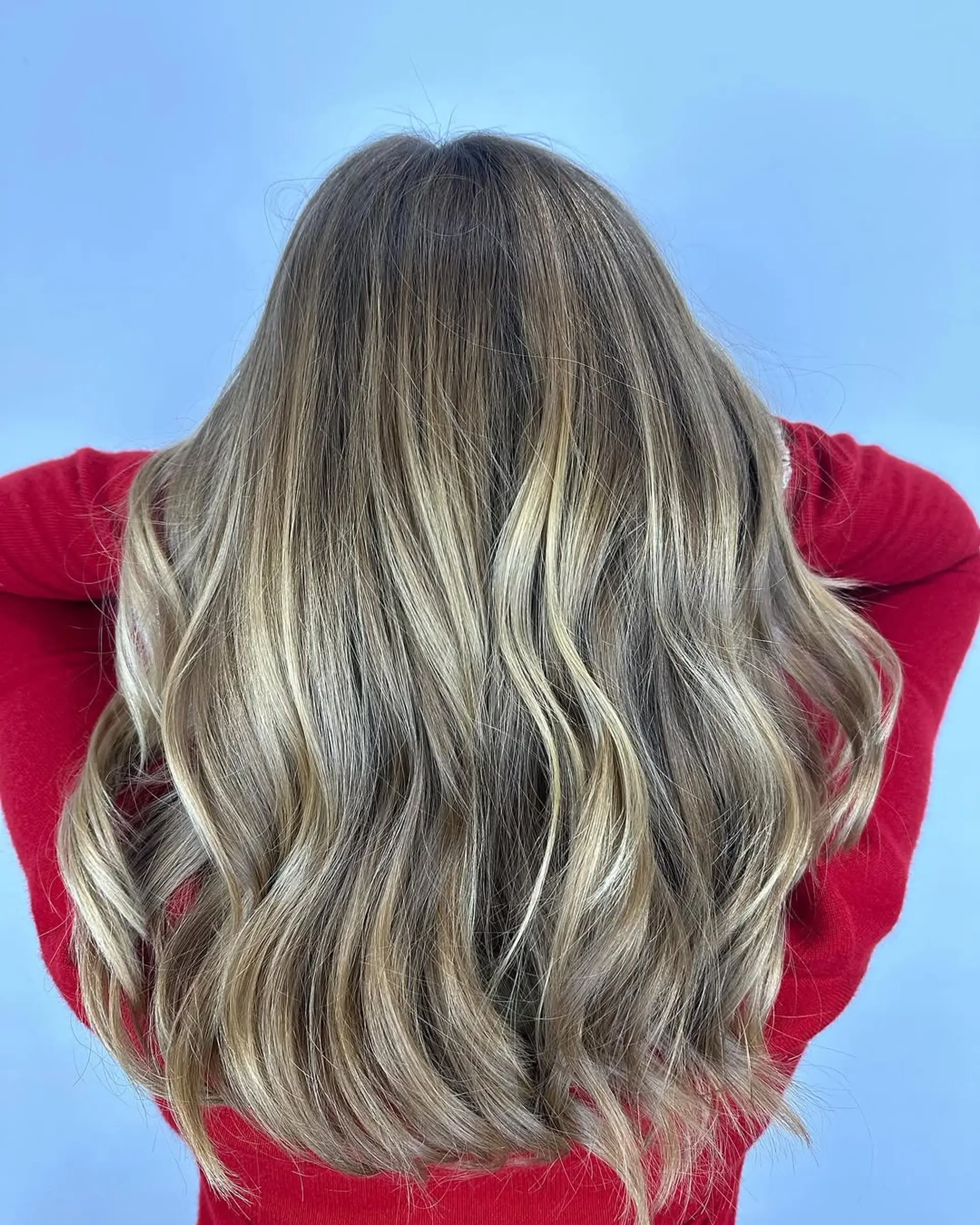A dimensional ash blonde balayage with cool-toned highlights. 1