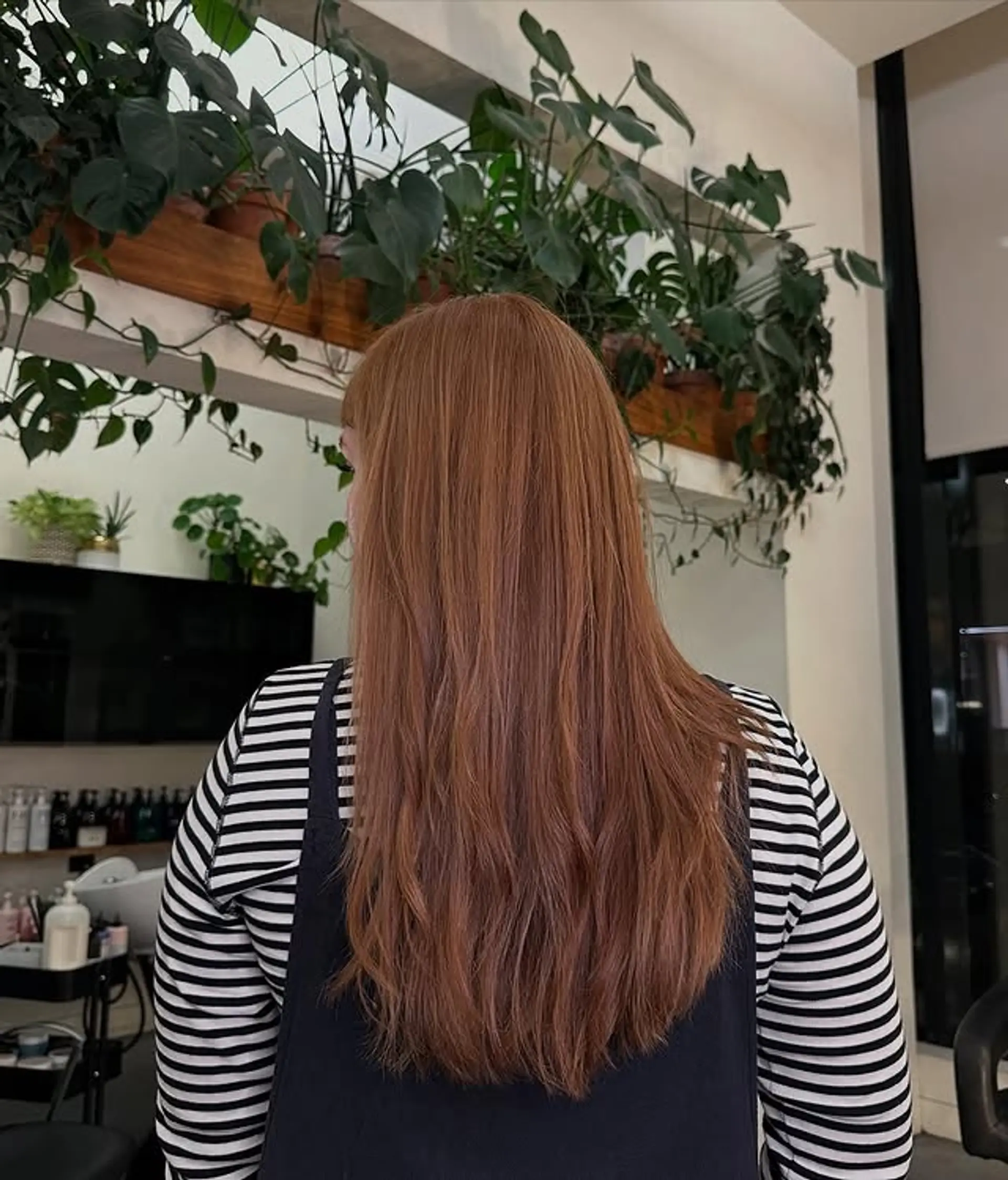 A long, wavy hairstyle with subtle layers and wispy bangs. 1