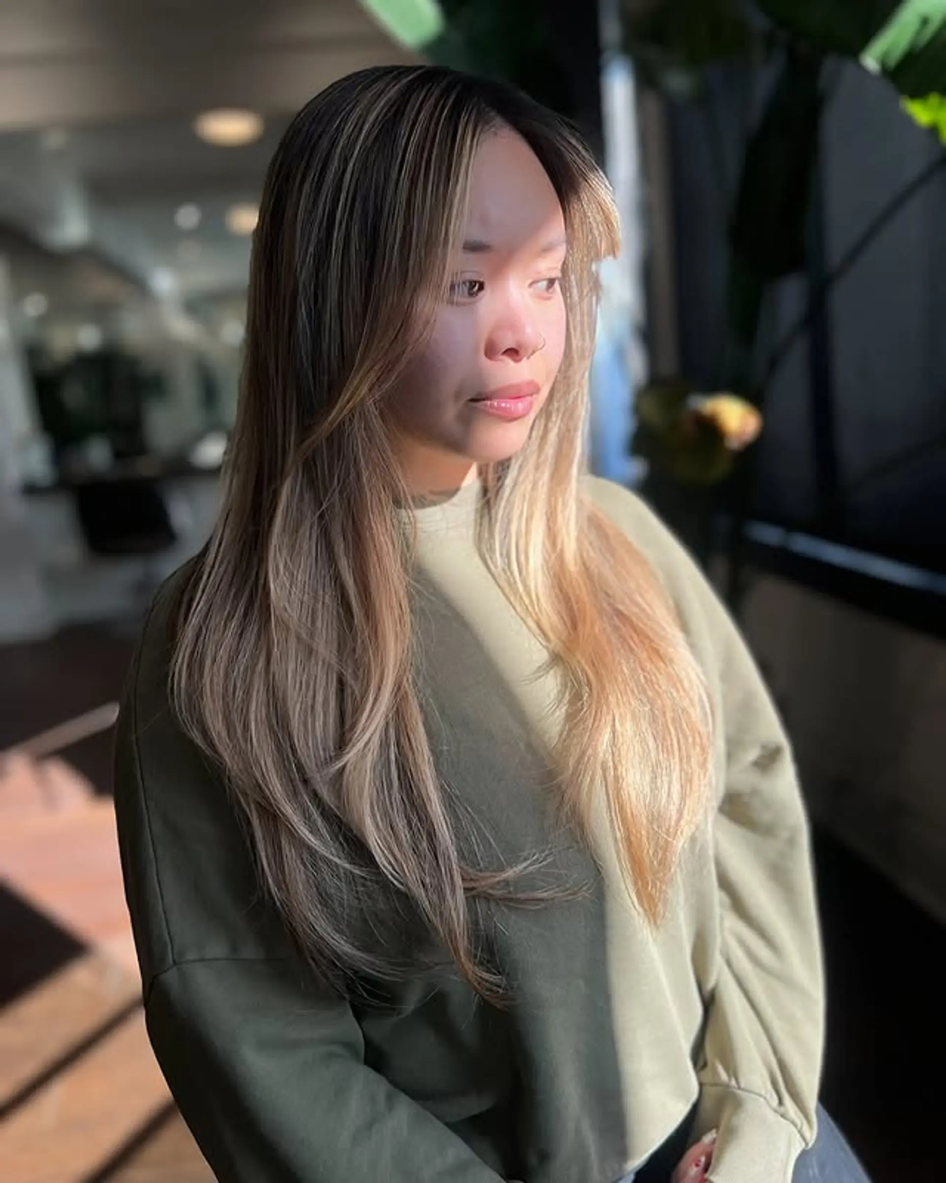 Long layered haircut with face framing highlights. 1