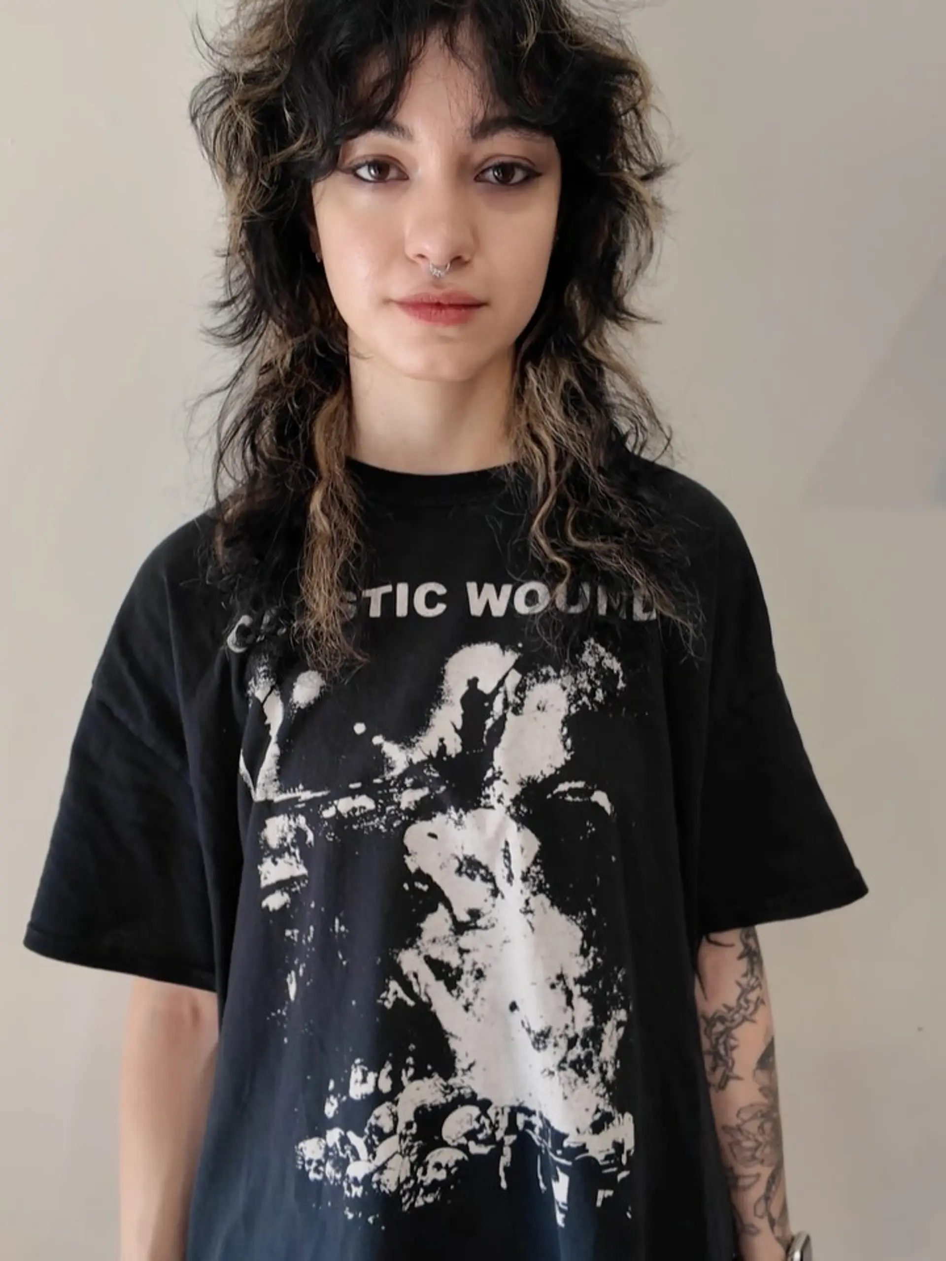 A textured layered shag mullet cut featuring face-framing fringe bangs and high-contrast chunky highlights. 1