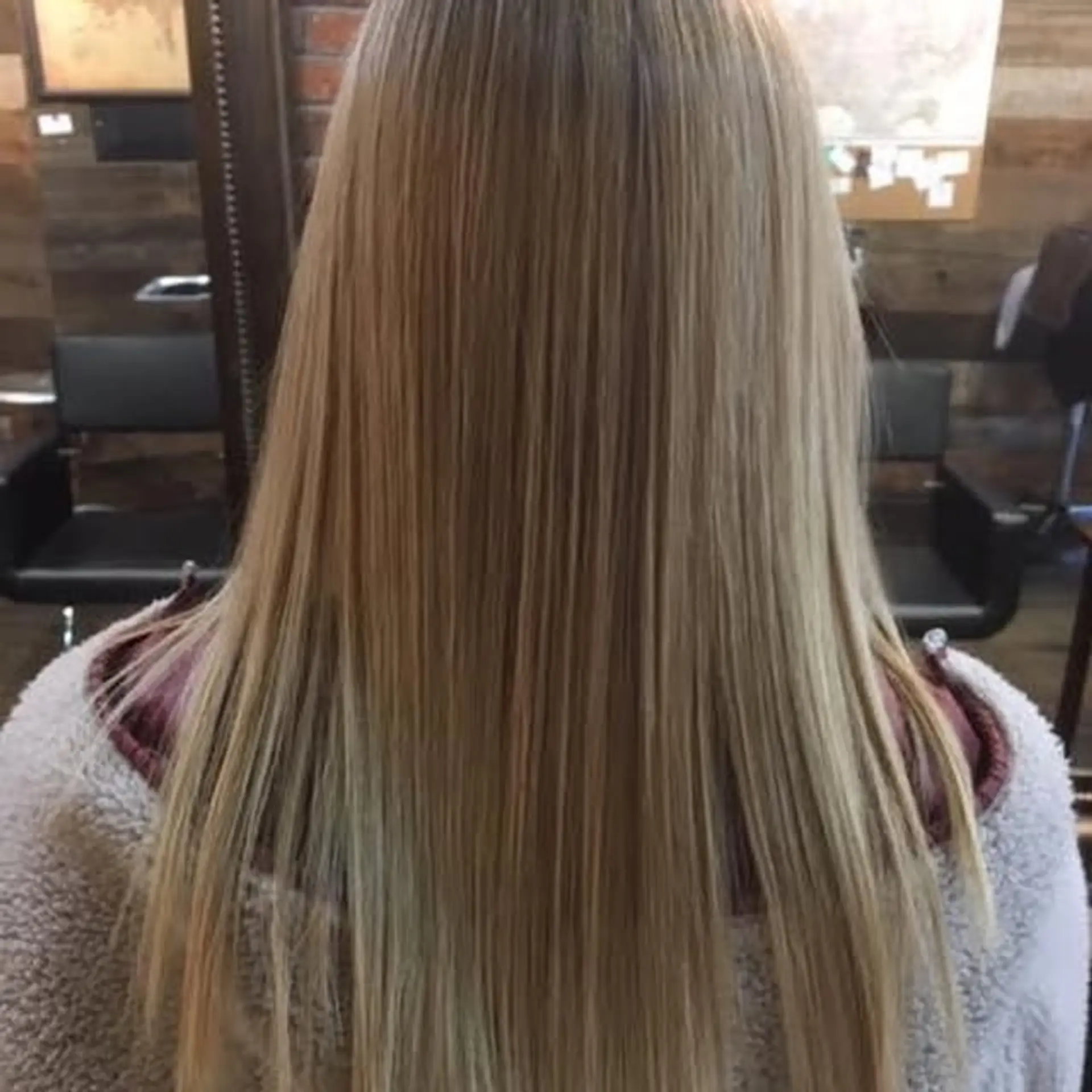 A long and straight balayage with blonde and brown tones. 1