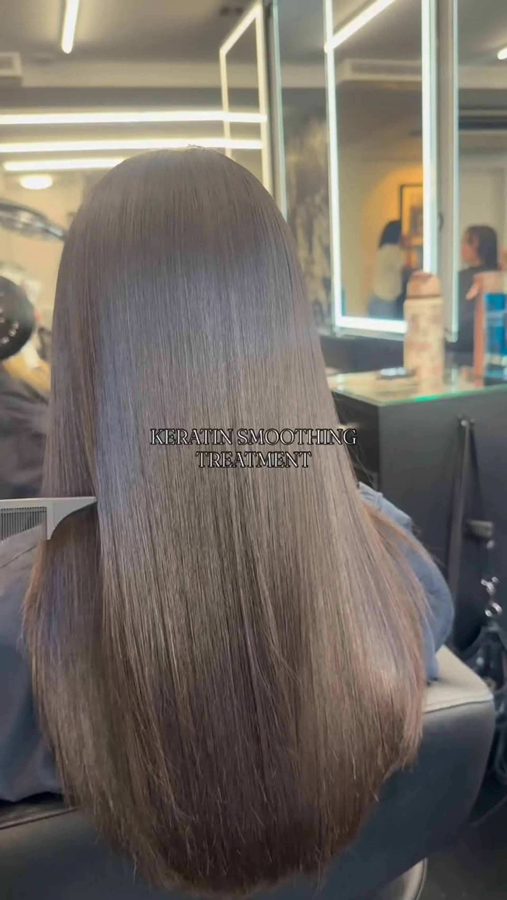 Silky and ultra-sleek long brunette hair after a professional keratin smoothing treatment. 1