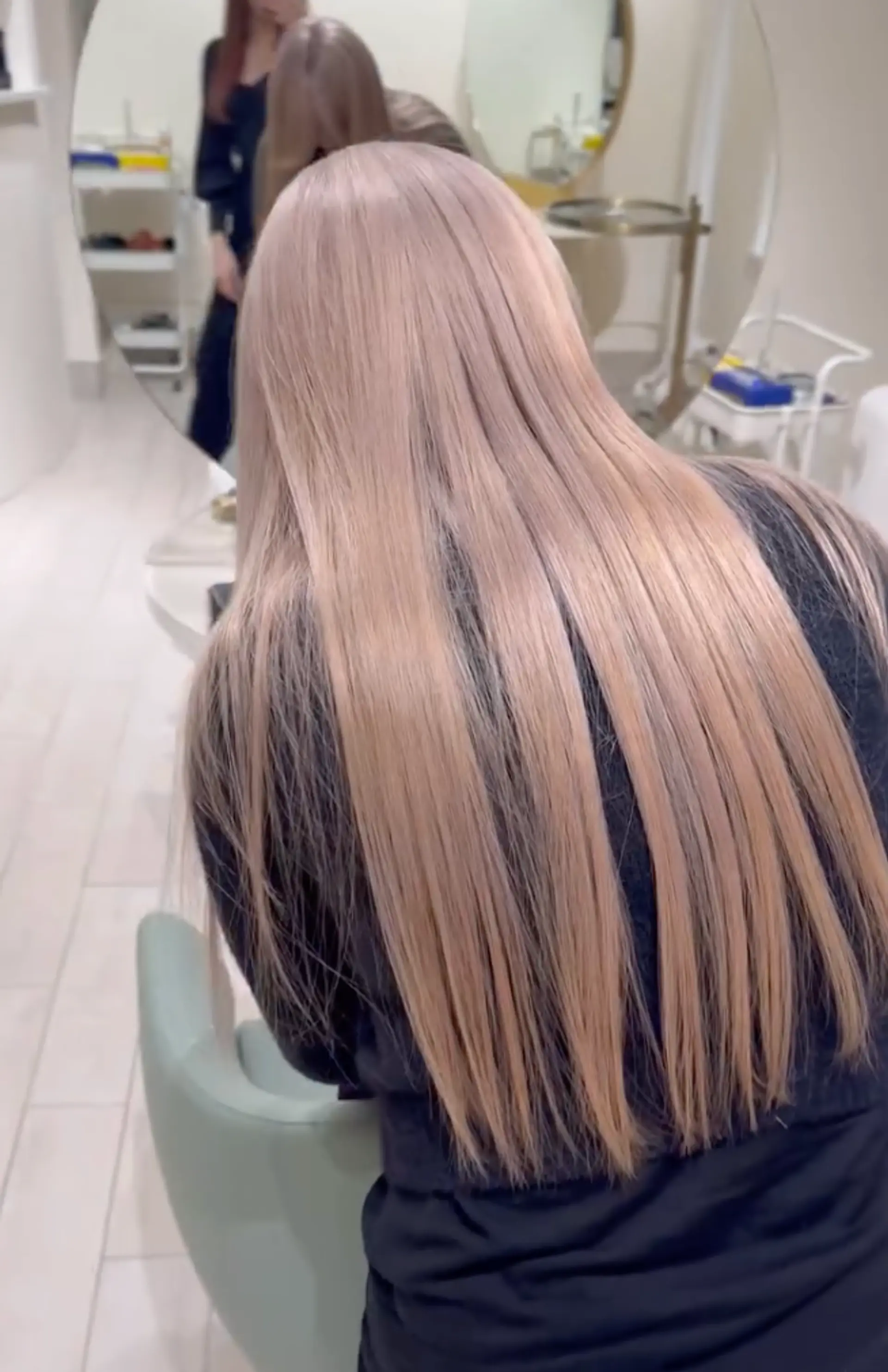 Straight, silky smooth, very long, light blonde hair cascading down elegantly. 2