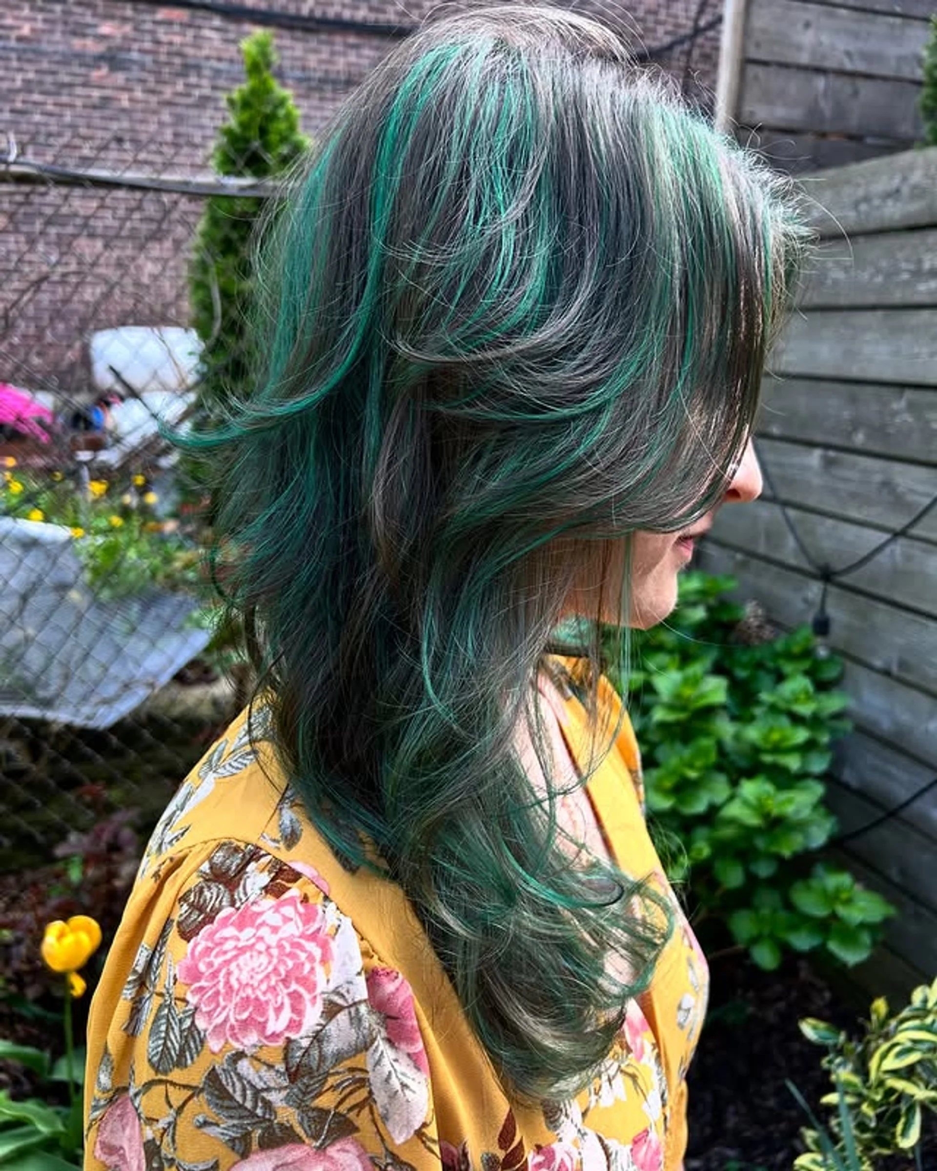 Edgy blunt bob haircut featuring a bold, saturated transformative teal hair color - Preview 1