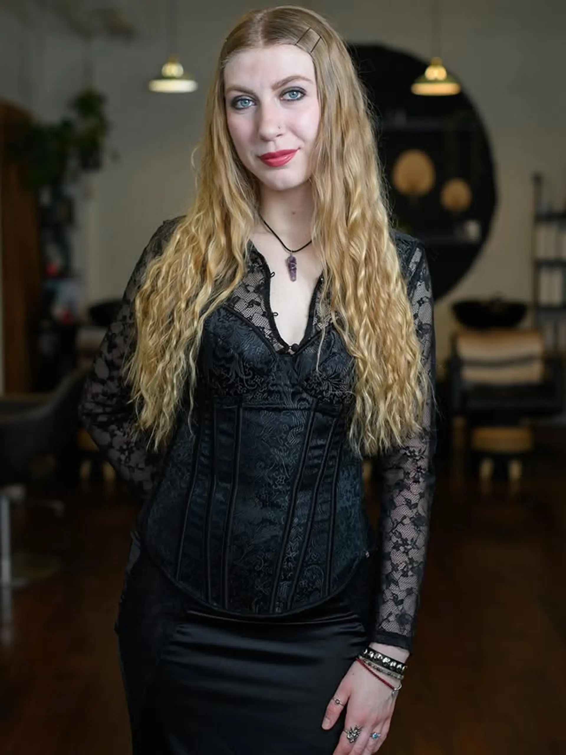 Long, wavy blonde hair styled with loose, beachy waves. 1