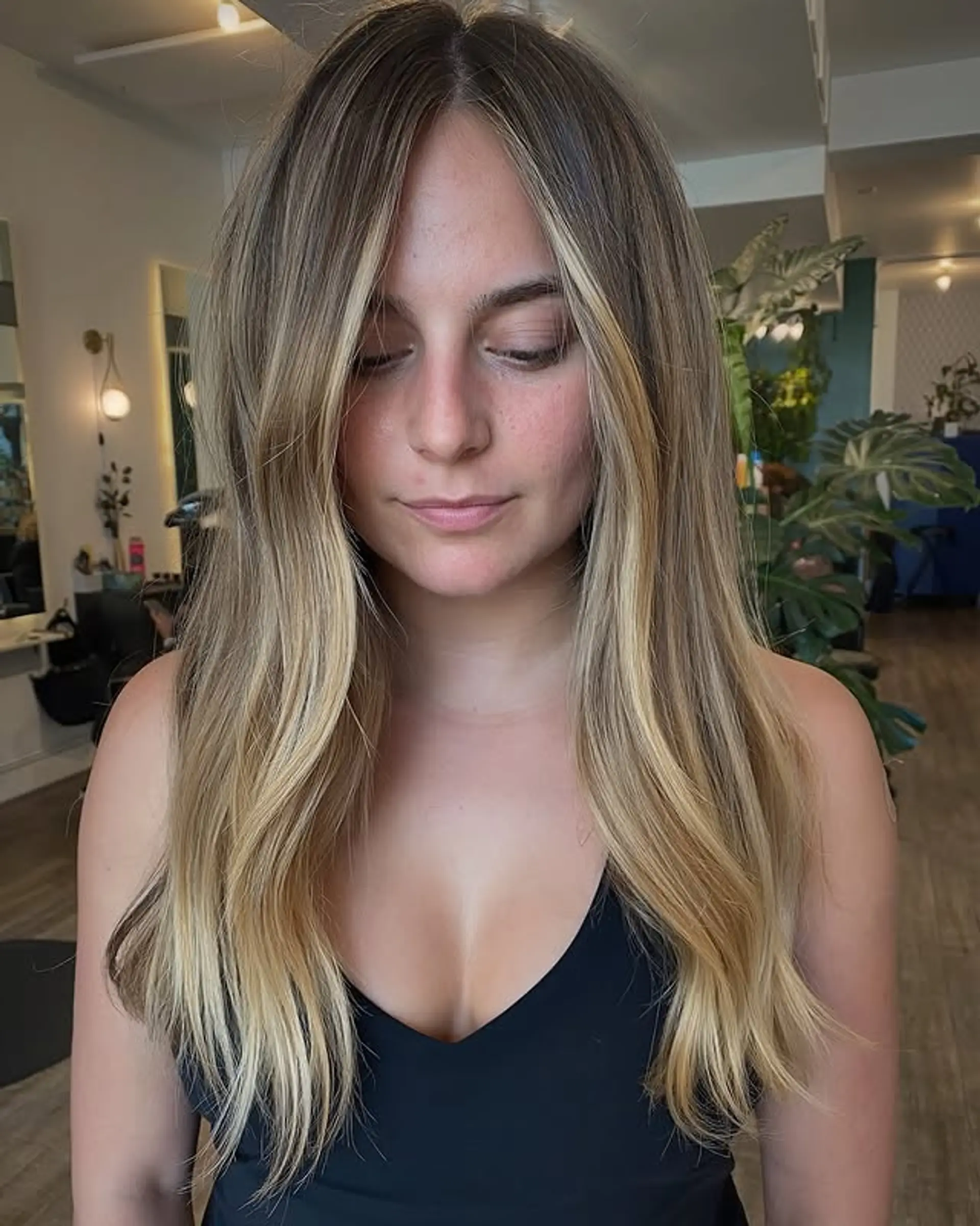 Long, straight hair with a bronde balayage and face-framing layers. 1