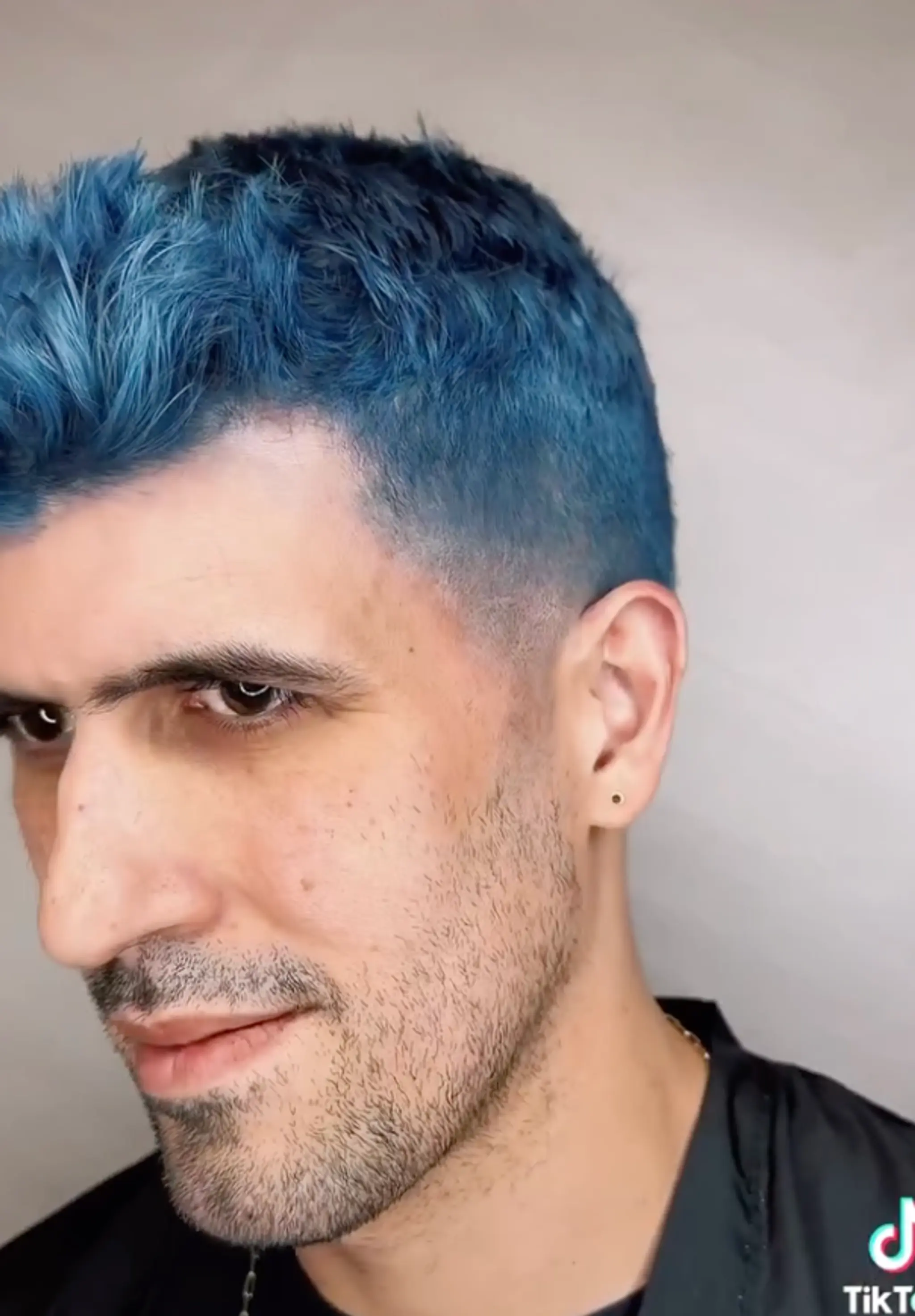A vibrant blue buzz cut with a tapered fade and textured top, creating a sleek and modern look.

Color by @simabeautynyc
Cut and style by @juliamannino_hair
