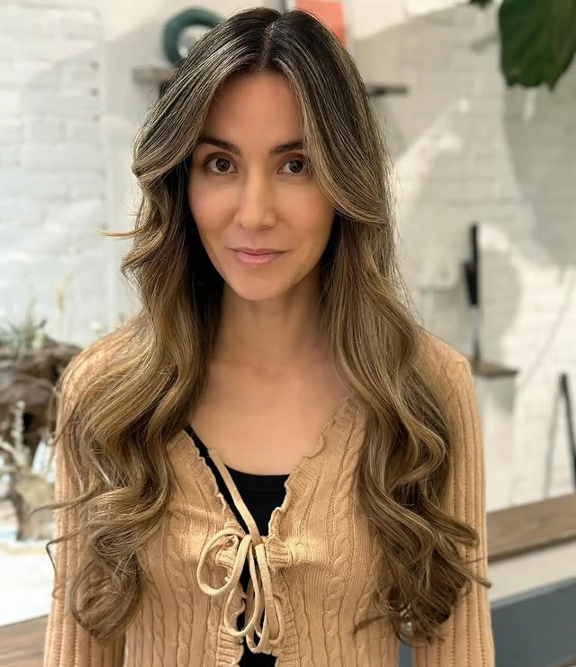 Long wavy hair with subtle waves and face-framing layers. 1