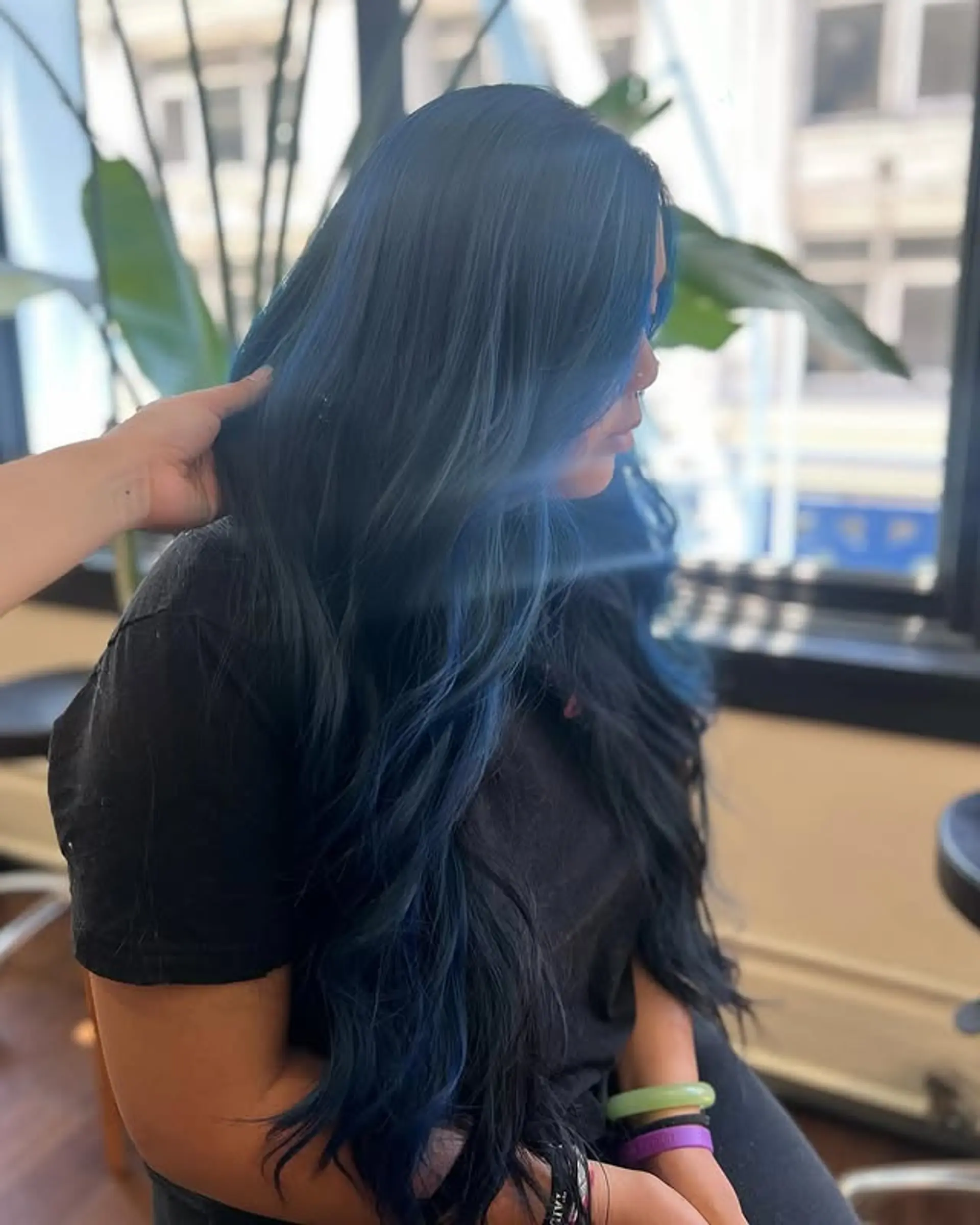 Long, wavy hair with a blend of black and blue shades. 1