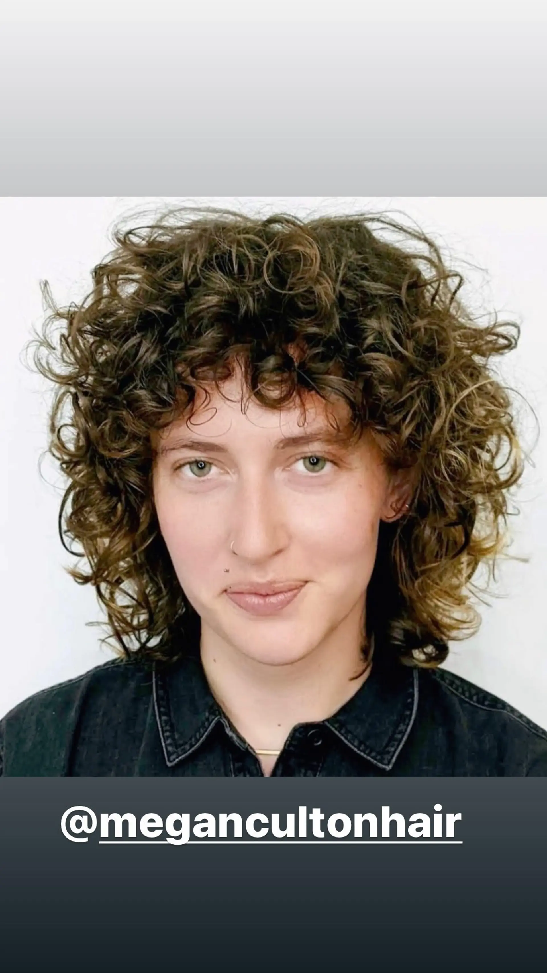 A medium-length curly shag with face-framing bangs and textured layers. 1