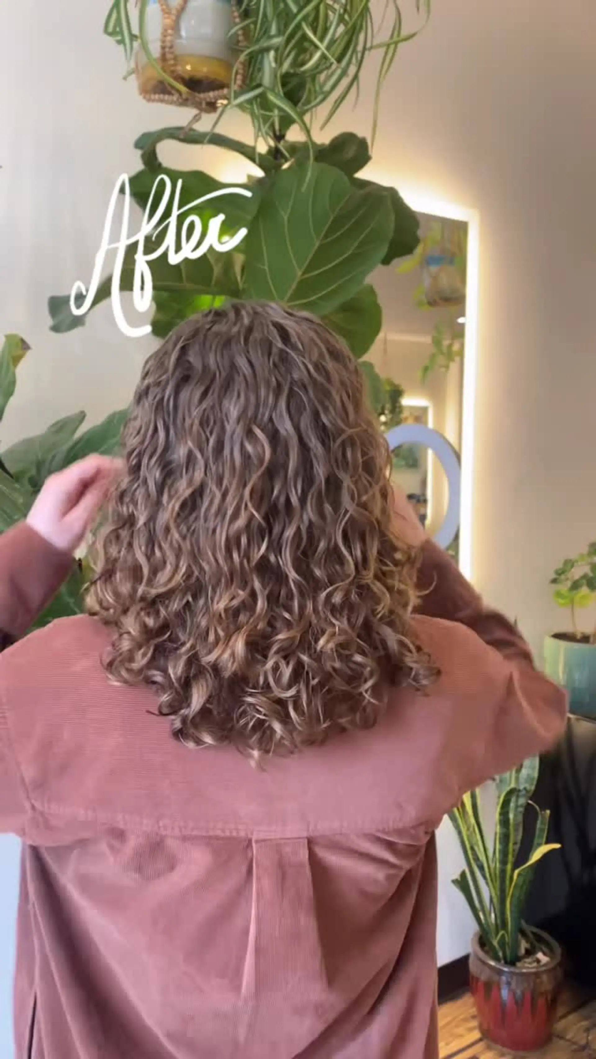 Medium-length layered haircut enhancing natural curl definition, volume, and shape. 1