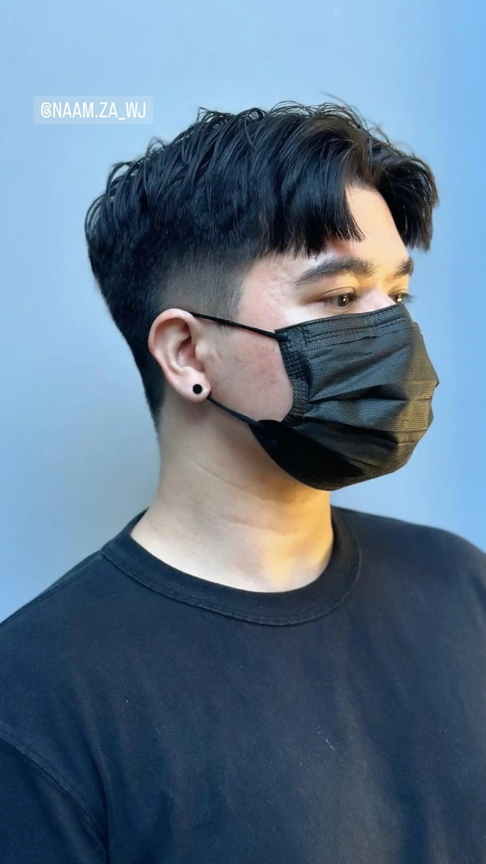 A modern bowl cut with faded sides and a textured top. 1