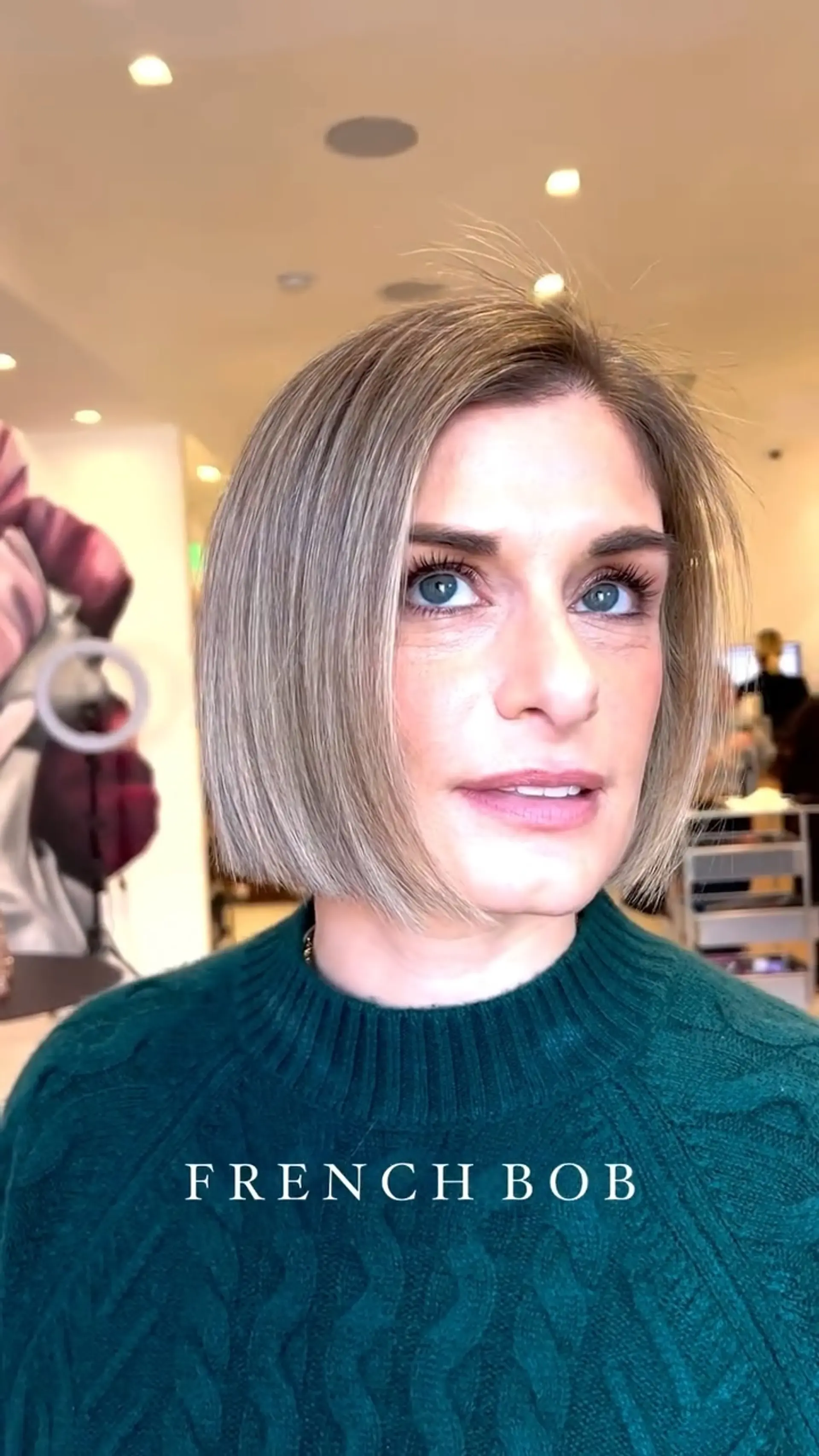 A sleek, jaw-length blunt French bob with blended cool ash blonde highlights. 1