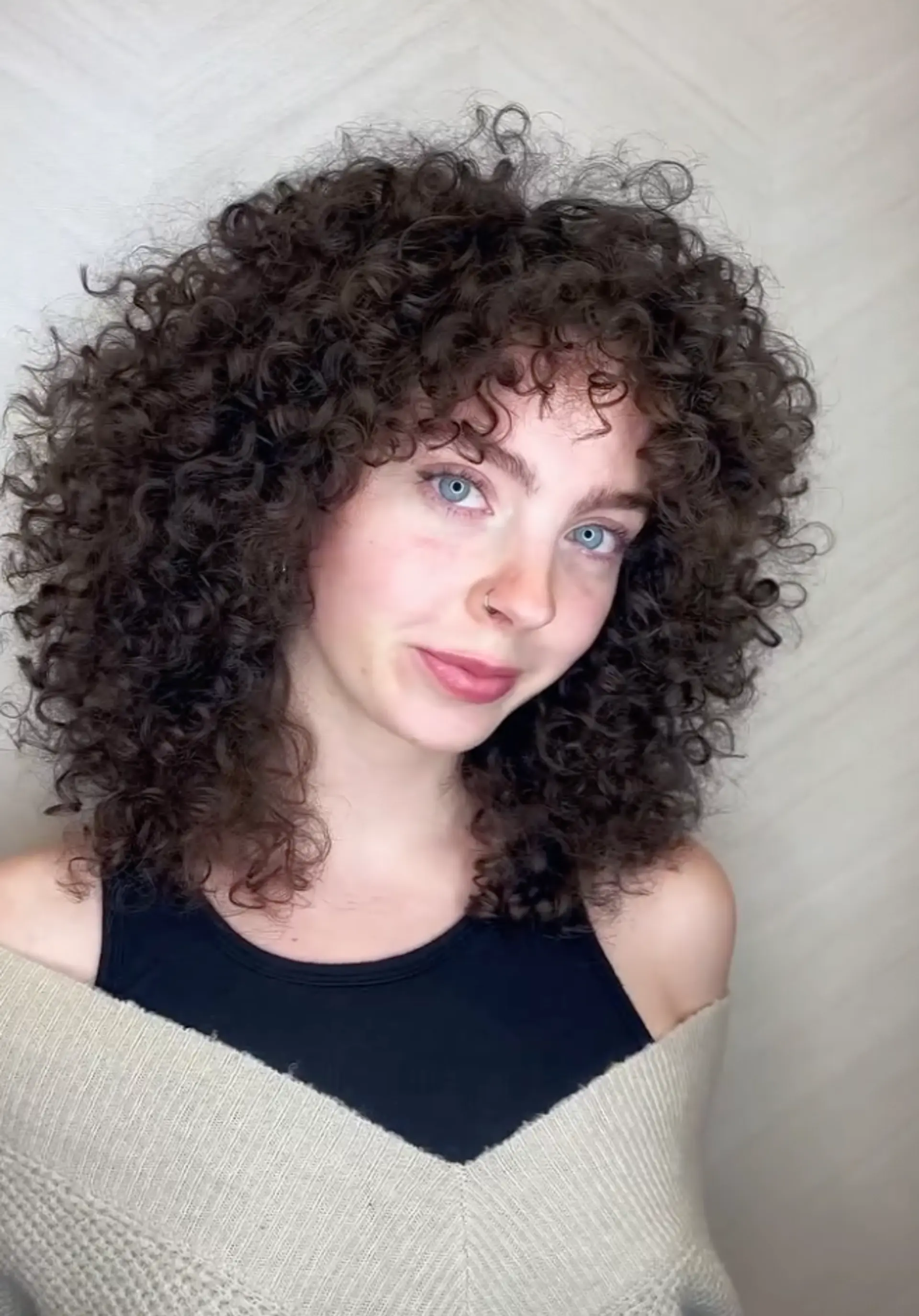 Medium-length natural curly hair with high volume, layered curls, and a curly fringe.

Cut and style by @juliamannino_hair 1