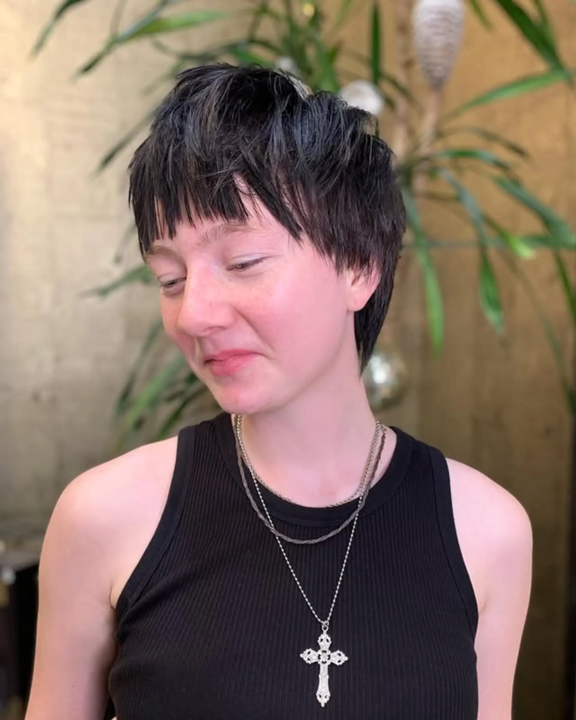 A short, edgy pixie cut with choppy layers and micro bangs. 1