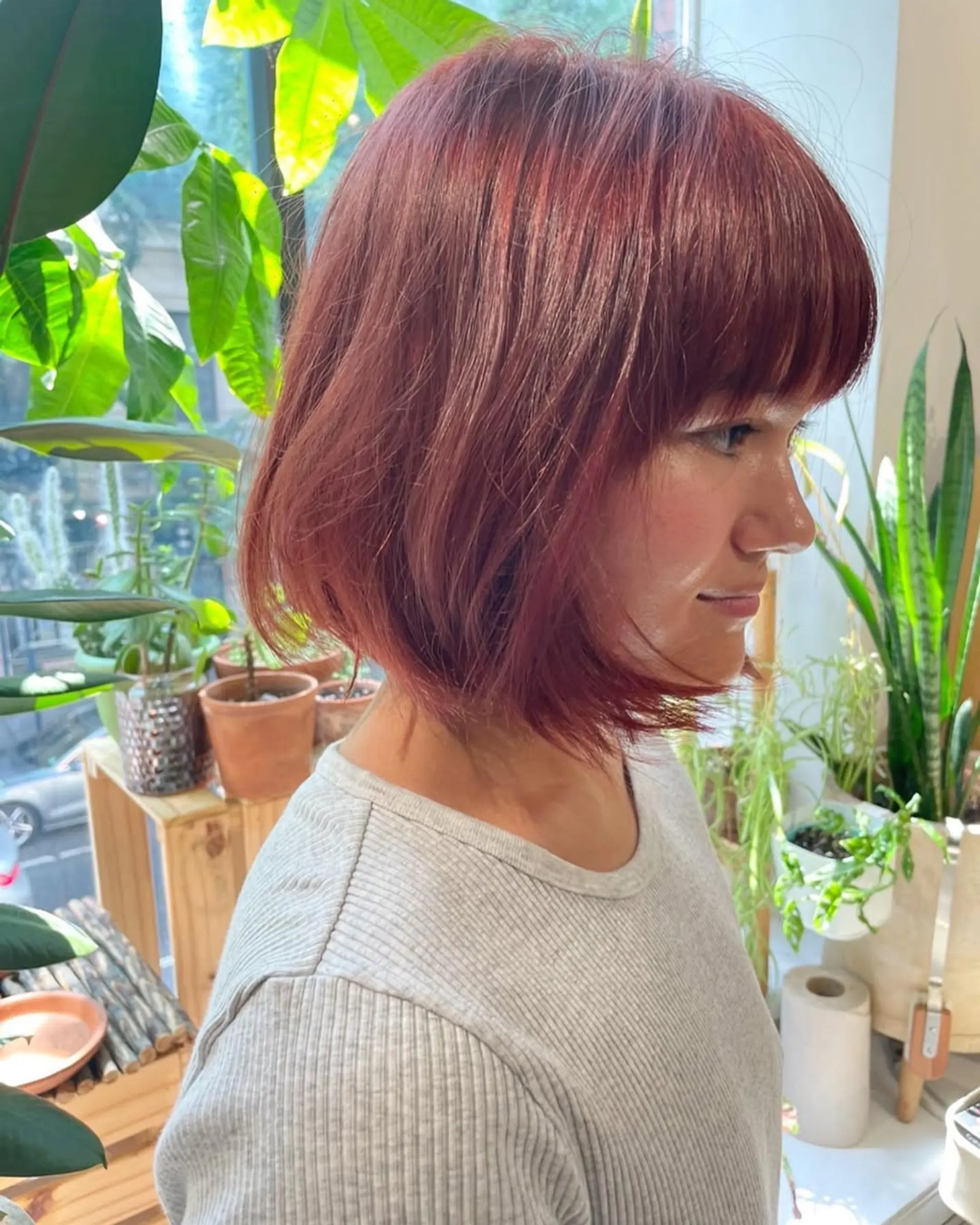 A shaggy, layered bob with face-framing bangs and a textured finish. 2