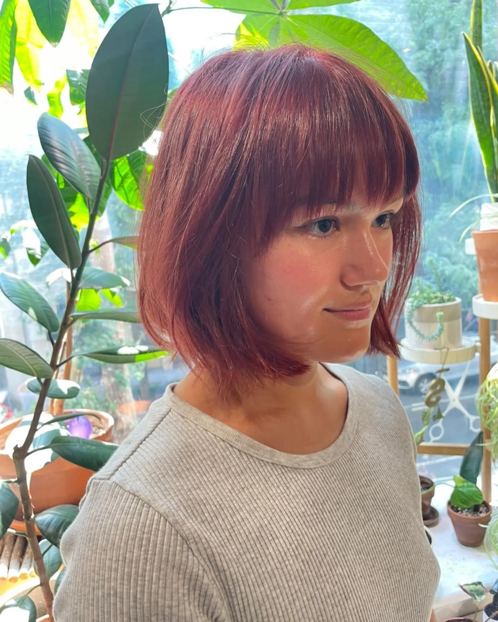 A shaggy, layered bob with face-framing bangs and a textured finish. 3