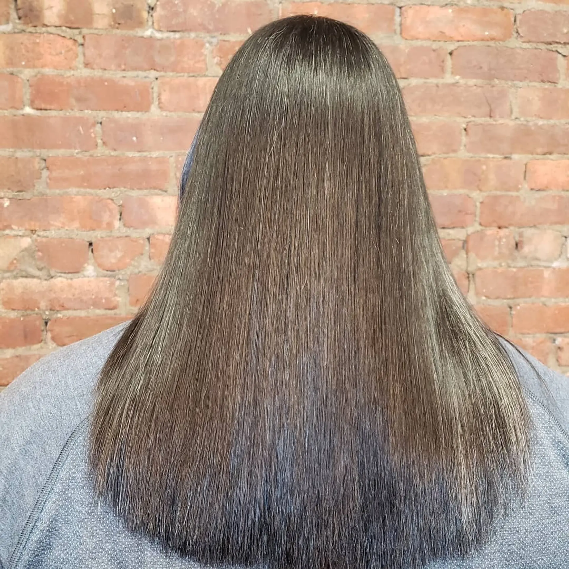 Sleek, ultra-straight long brunette hair with a glossy finish. 1