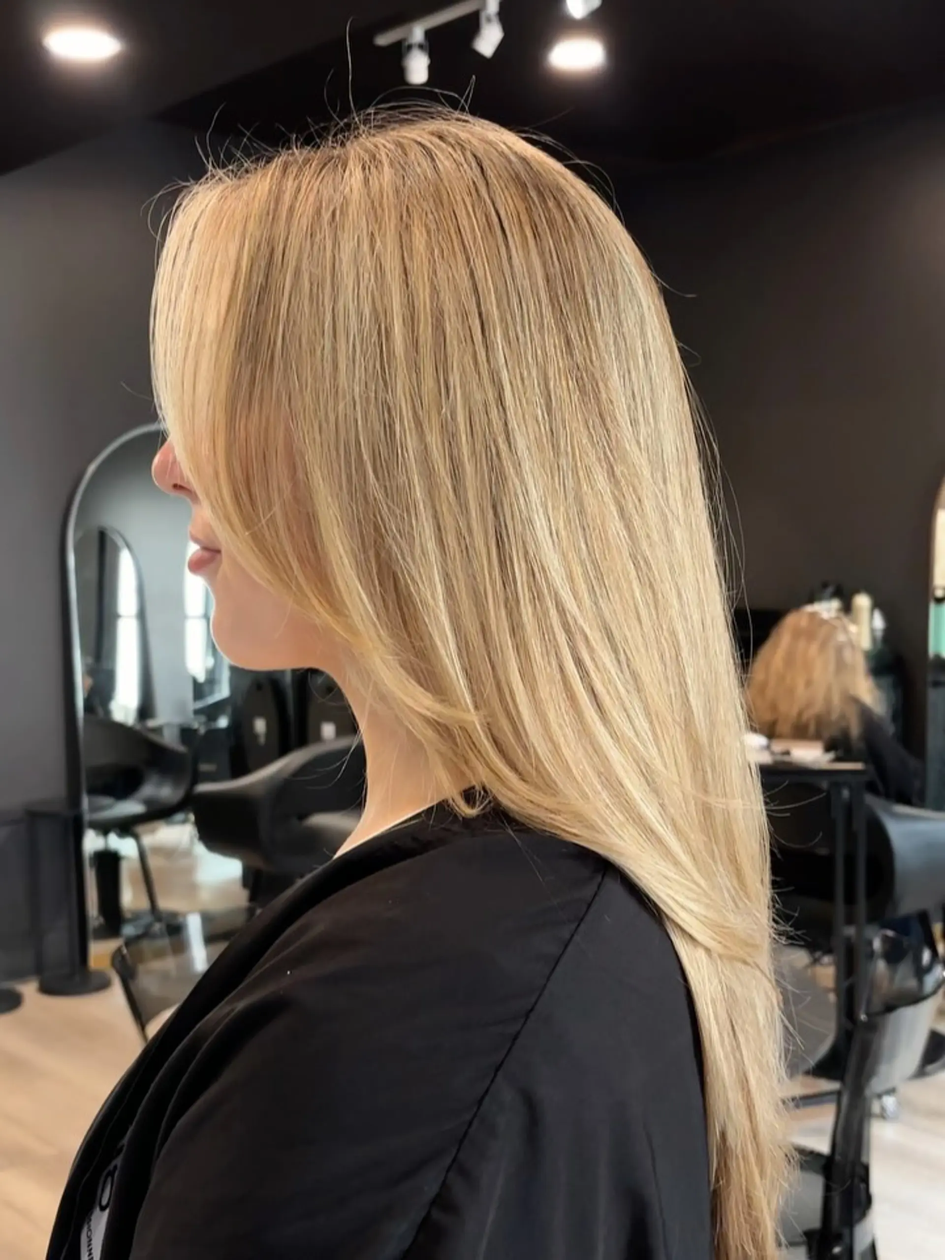 Smooth, long warm blonde hair featuring seamless dimensional highlights and subtle face-framing layers. 1