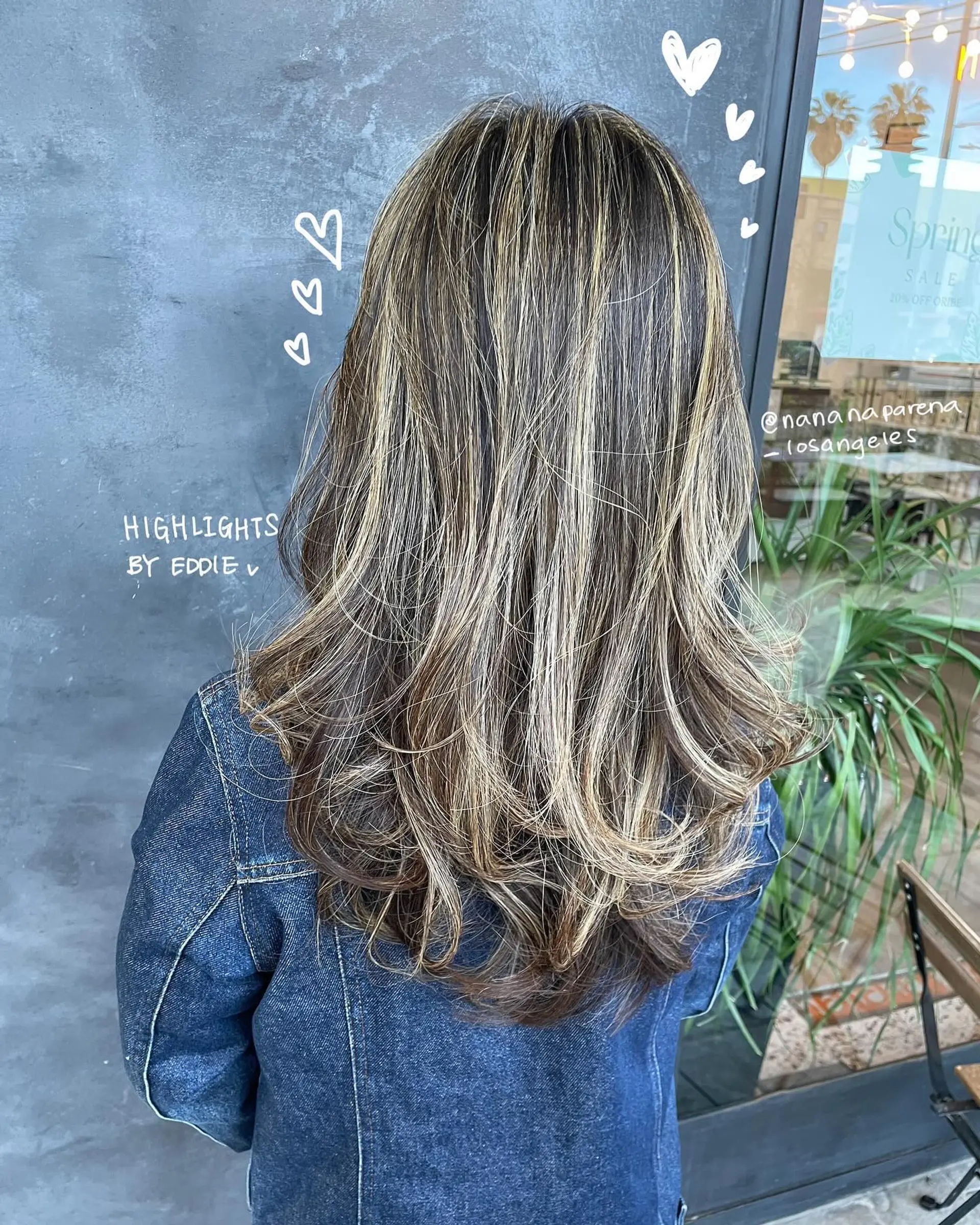 A layered long hairstyle featuring a bronde balayage with face-framing. 1