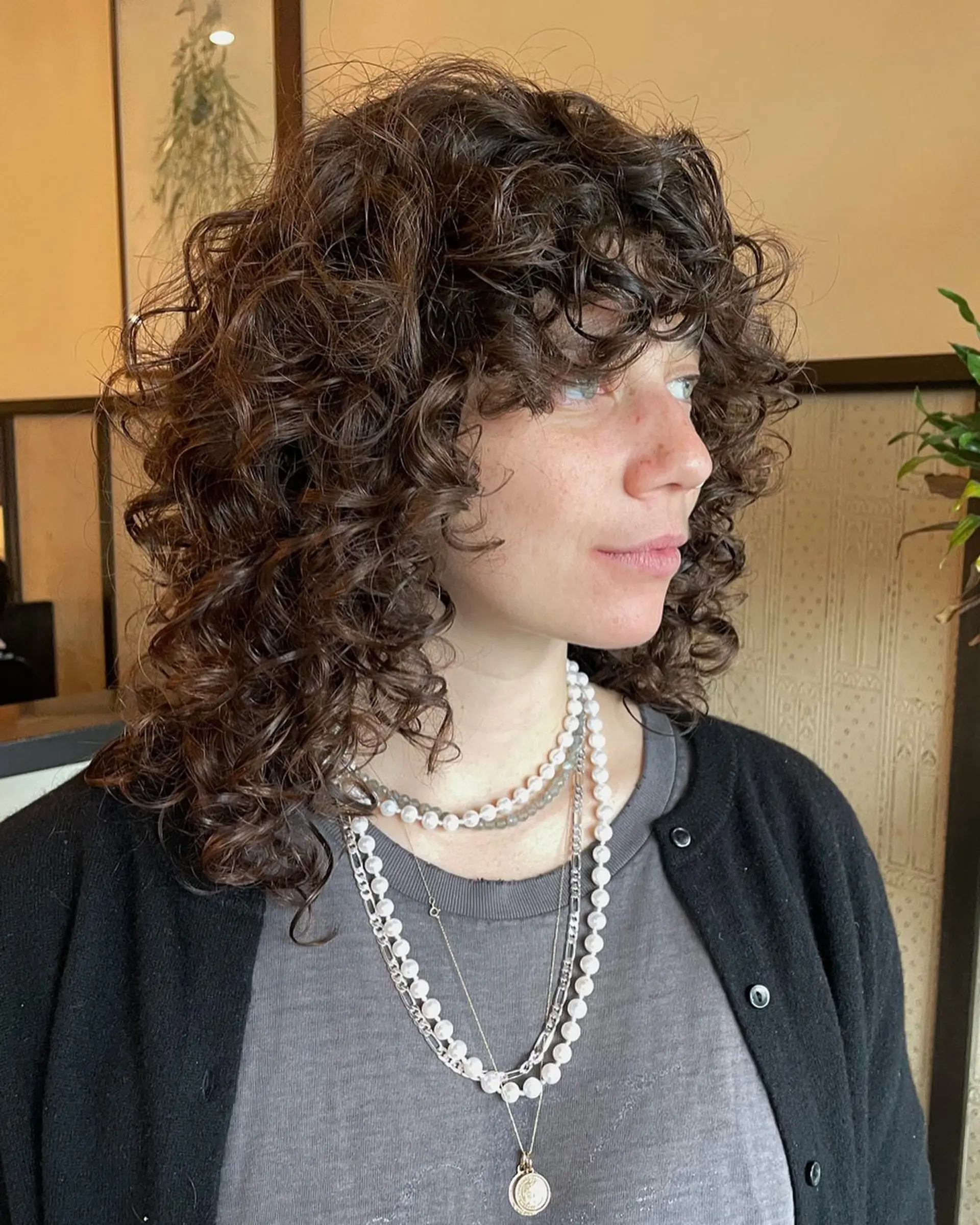 A curly shag lob with layers and a fringe, perfect for embracing natural texture. 1