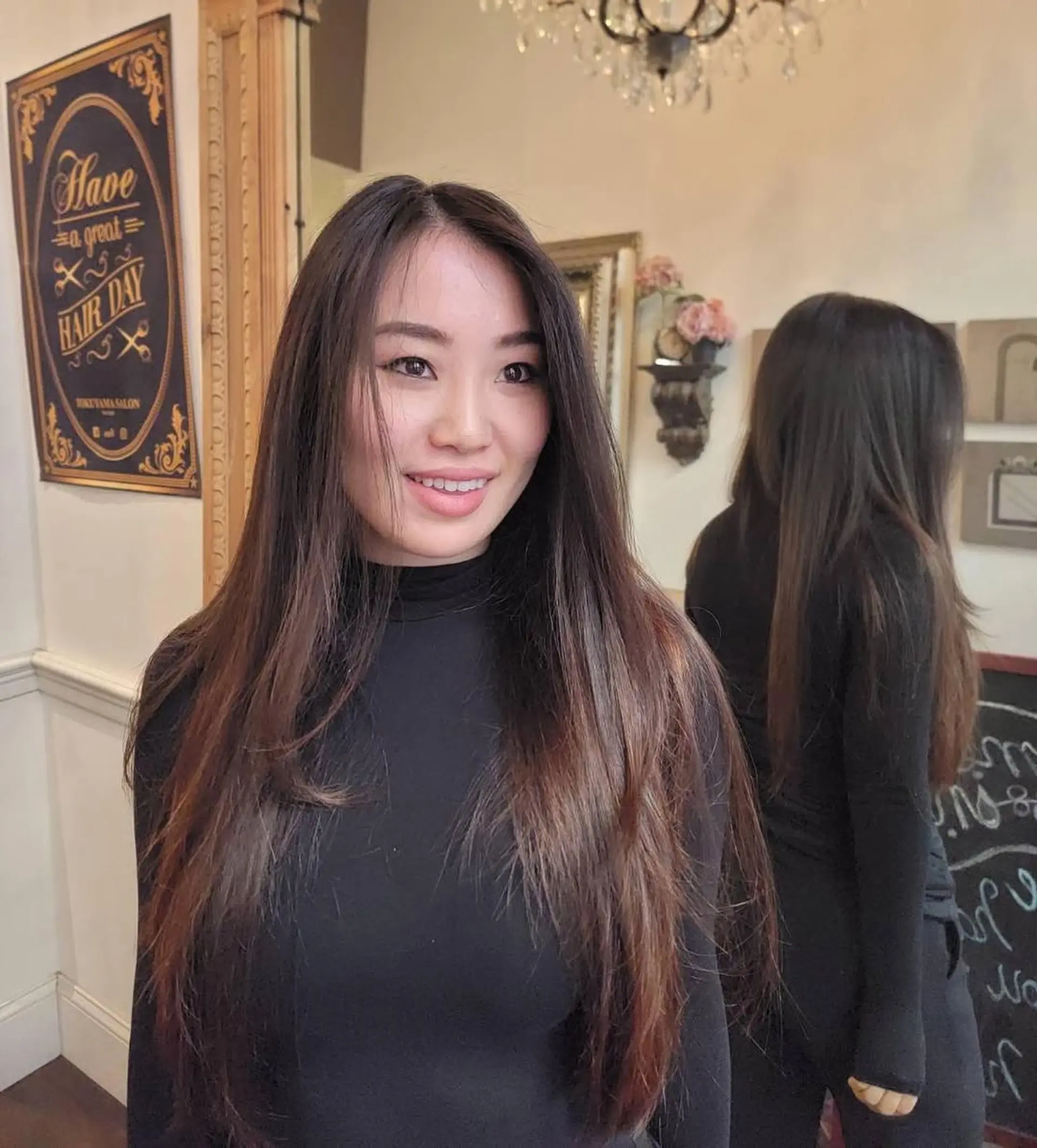 Long, straight, and sleek hairstyle with a center part and minimal layers in dark brown. 2