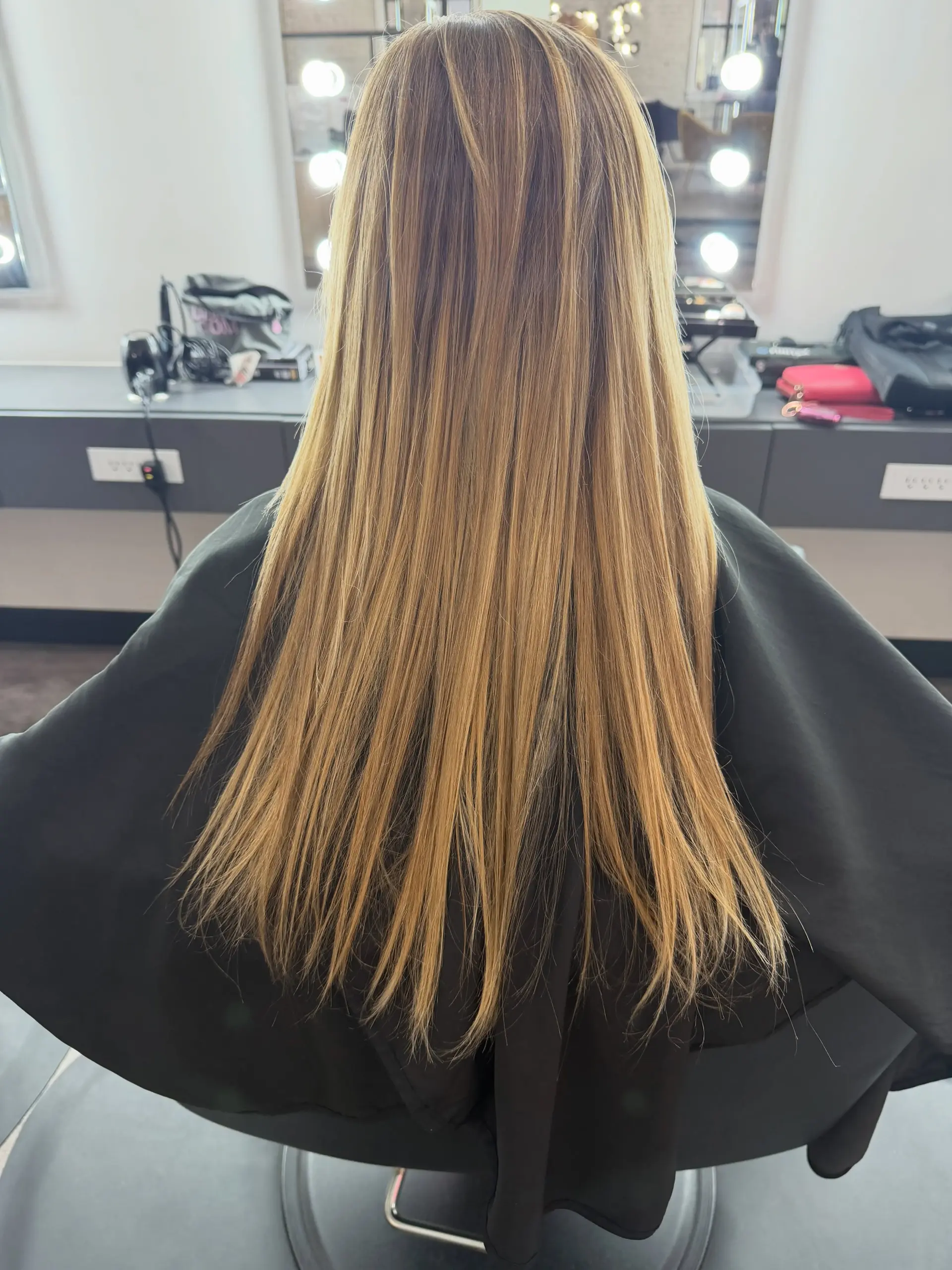 Long straight dimensional beige blonde hair with blended contrast and subtle depth. 1